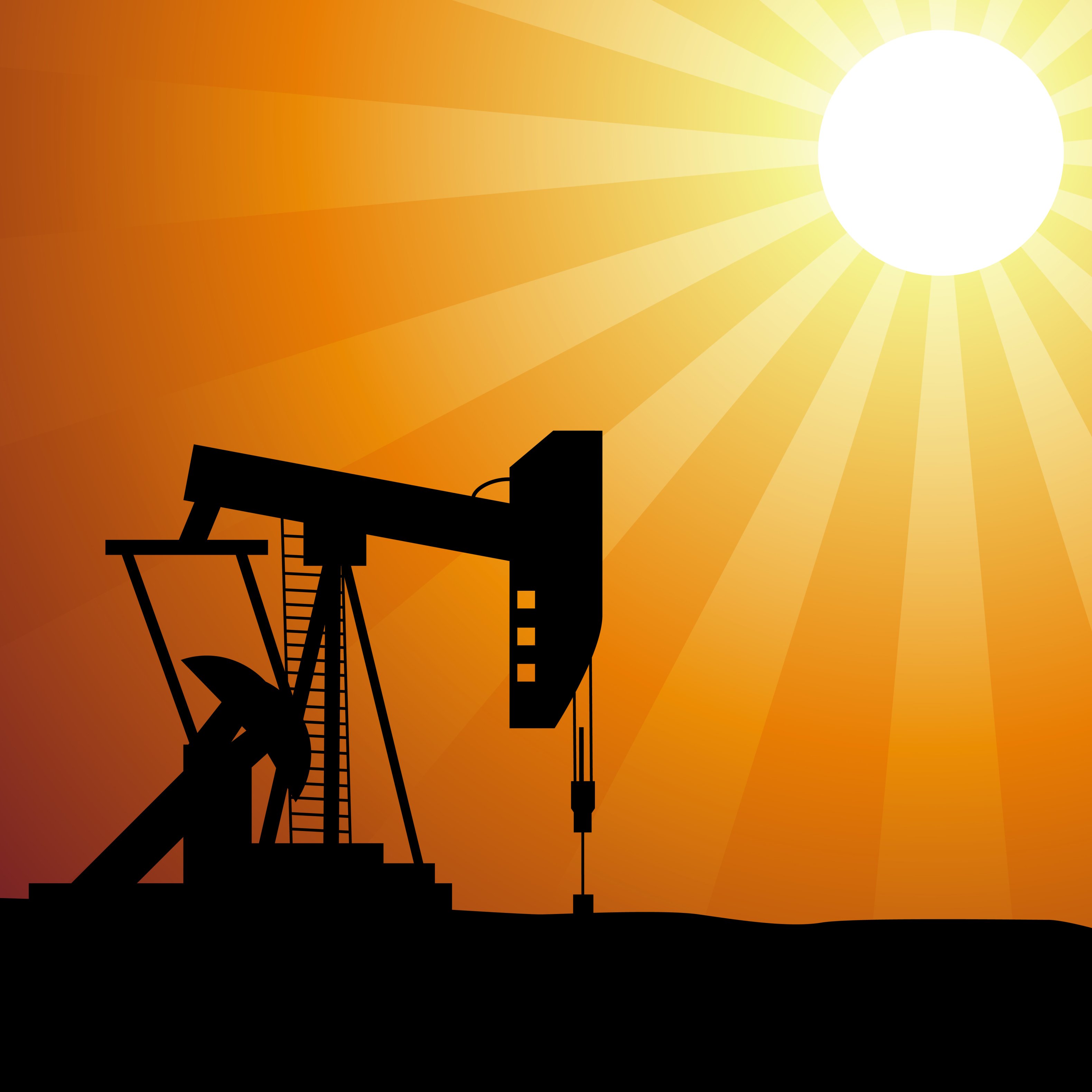 Oil well silhouette on sunset