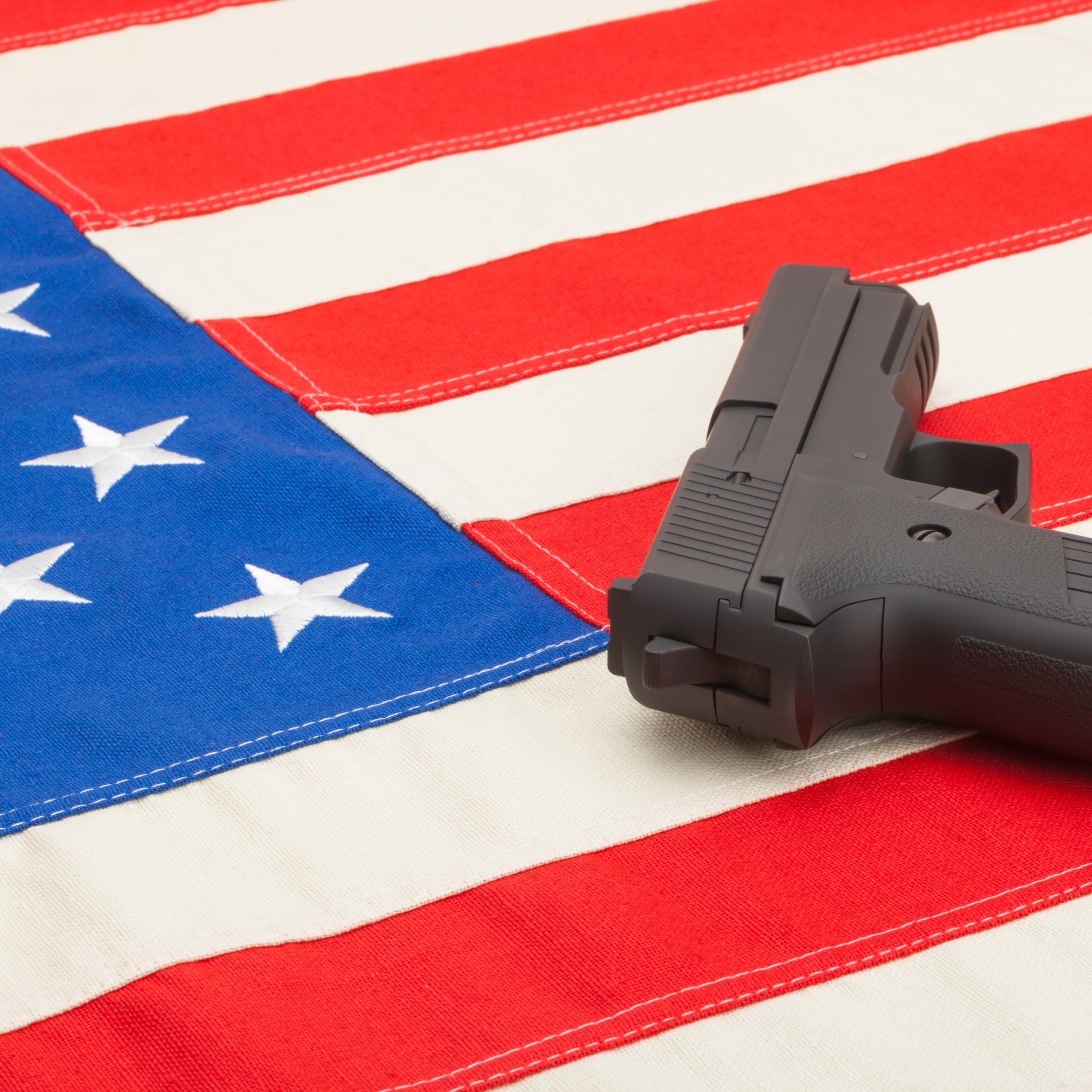 Handgun over US flag - studio shoot