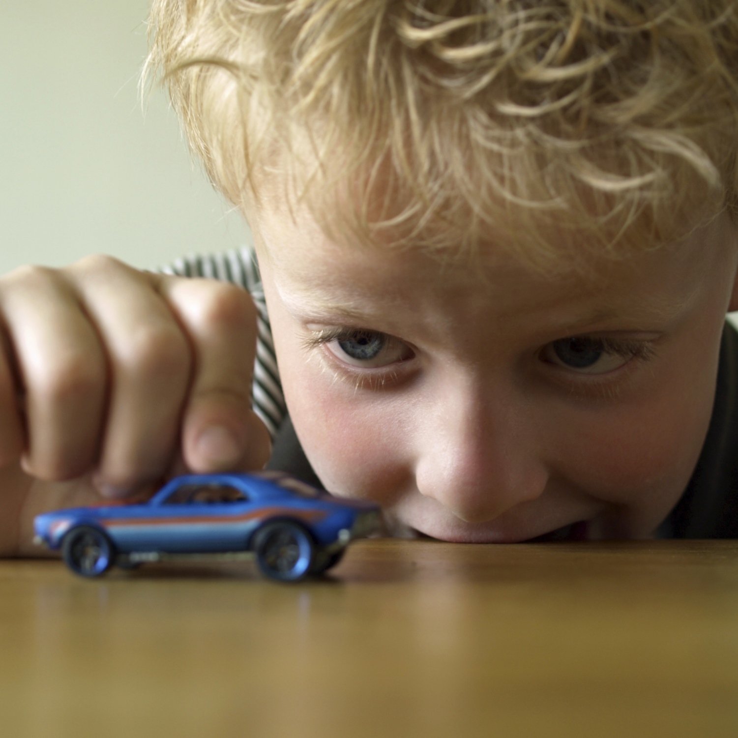 playing with toy car