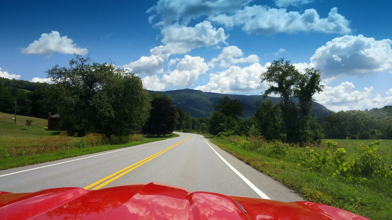 Red Sportscar Hot Rod Hood Driving into Vermont Mountains