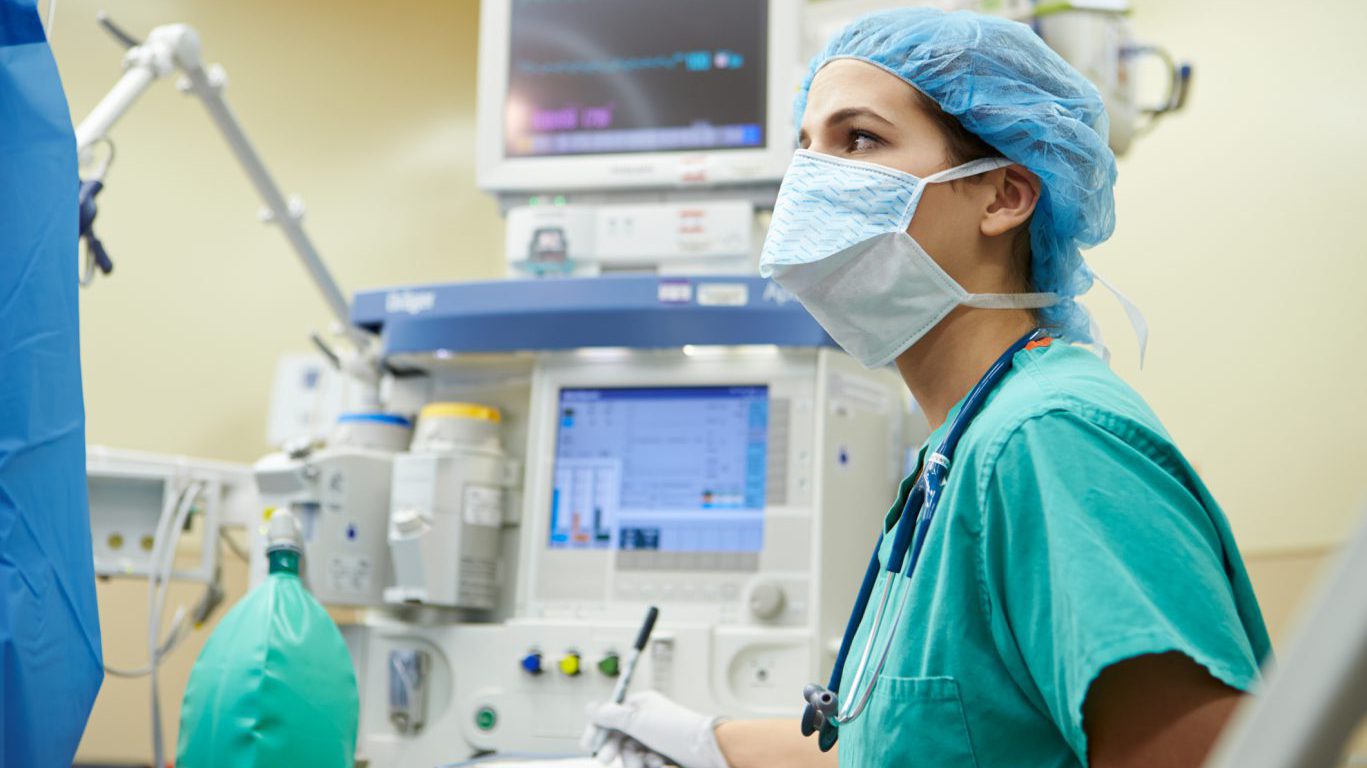 Anesthetist Working In Operating Theatre