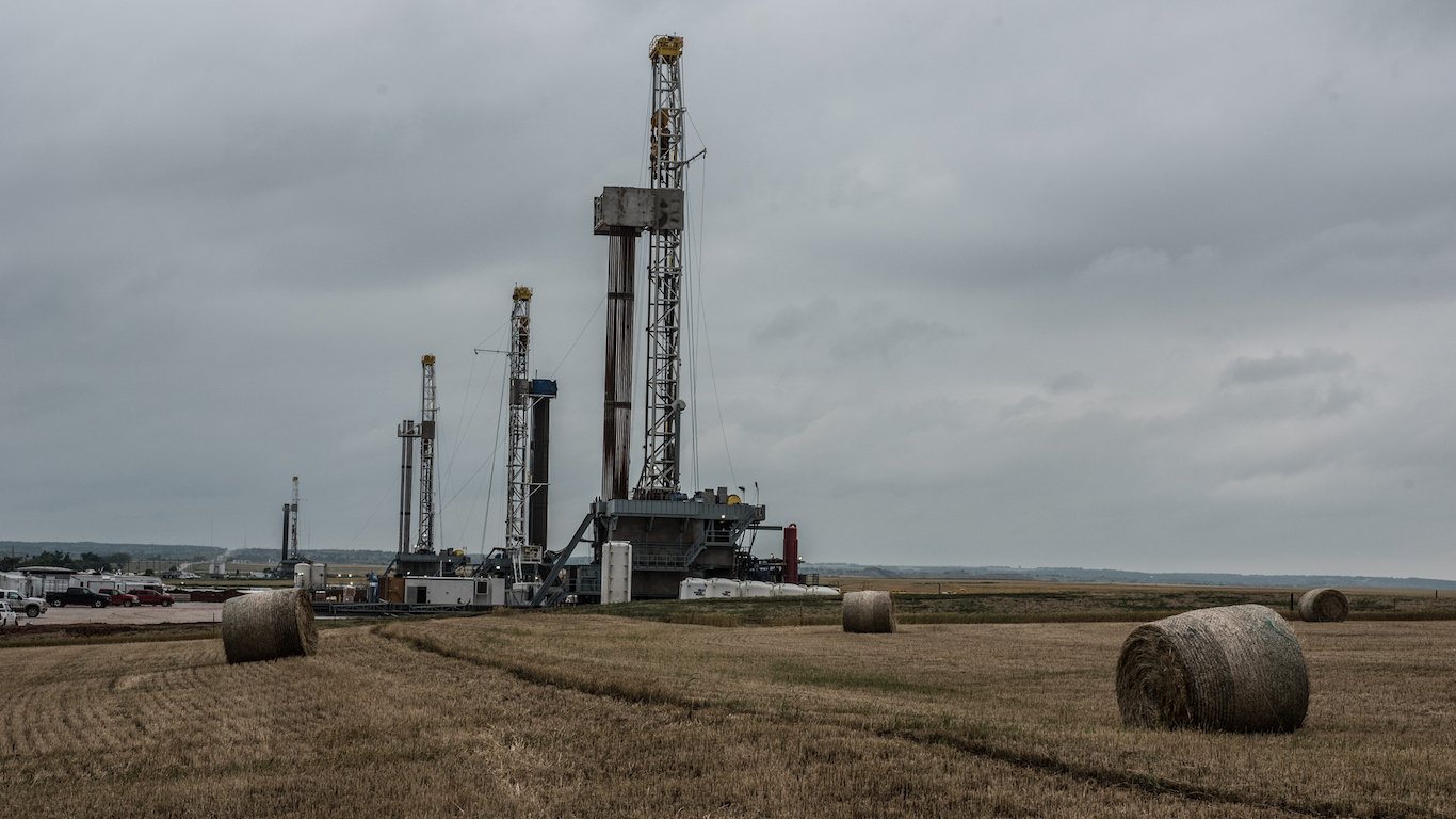 Fracking oil rig drills in Oklahoma field, gas extraction