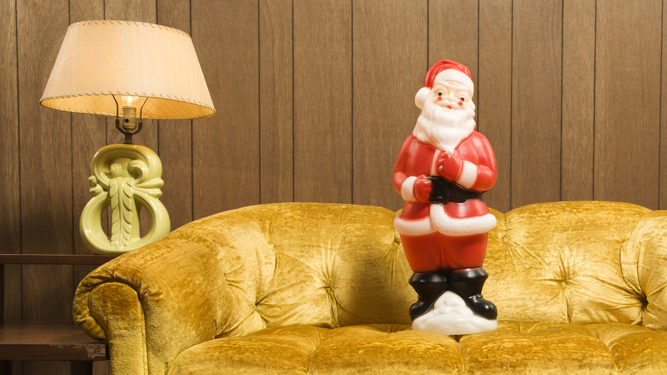 Santa clause figurine on retro style couch. Christmas 1979