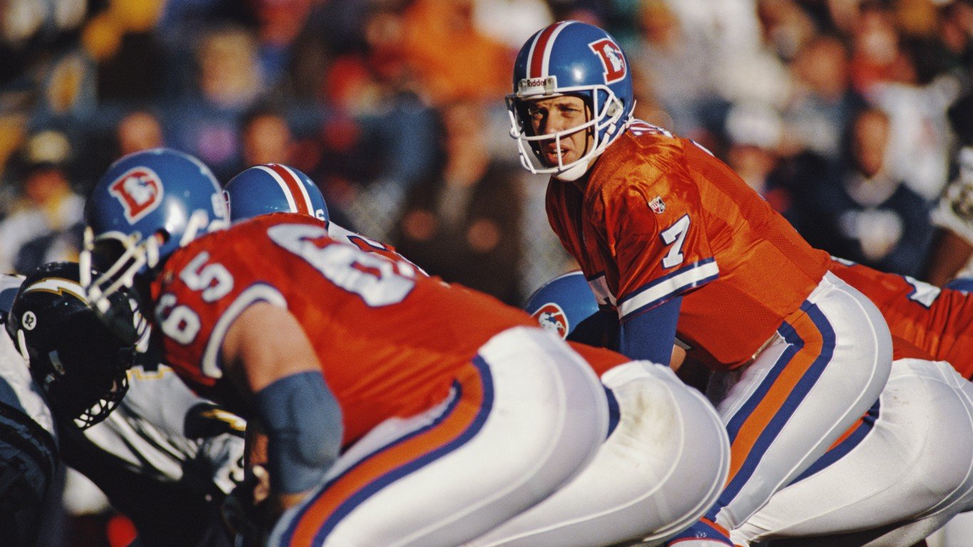 John Elway #7, Quarterback for the Denver Broncos calls the play on the line of scrimmage during the American Football Conference West game against the San Diego Chargers on 19 November 1995 at the Mile High Stadium, Denver, Colorado,United States. The Chargers won the game 27 - 30.  (Photo by Jamie Squire/Allsport/Getty Images)
