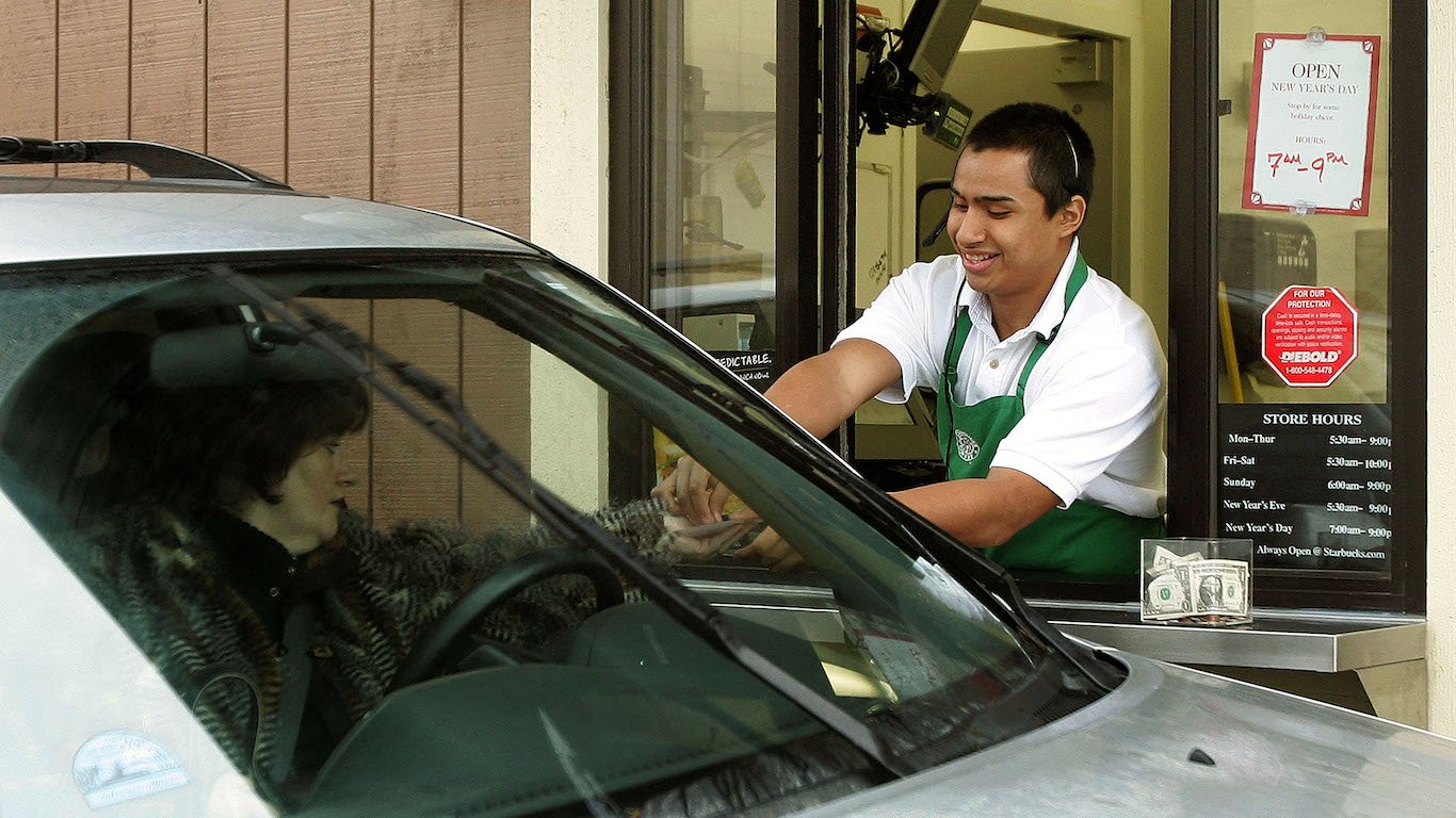 Starbucks employee and customer at a drive-thru