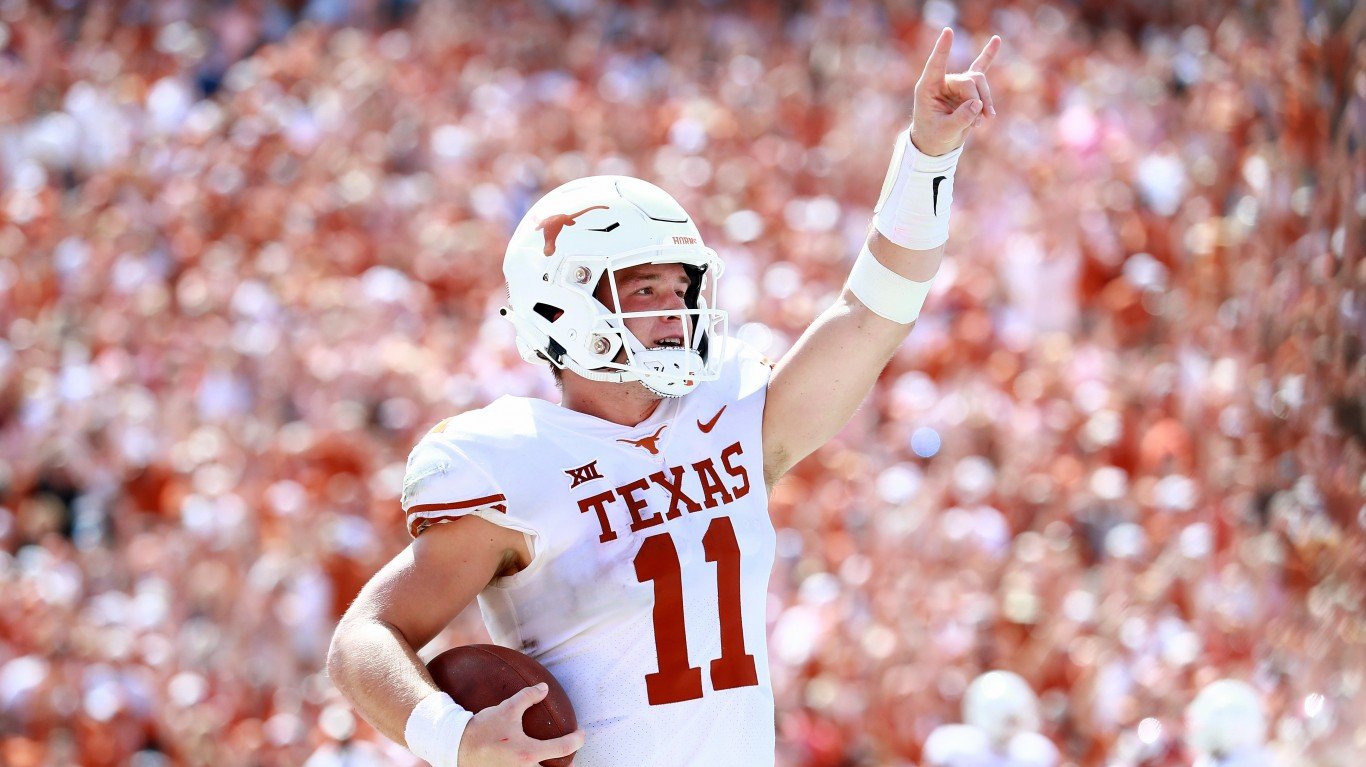 DALLAS, TX - OCTOBER 06:  Sam Ehlinger #11 of the Texas Longhorns celebrates after scoring a touchdown against the Oklahoma Sooners in the third quarter of the 2018 AT&amp;T Red River Showdown at Cotton Bowl on October 6, 2018 in Dallas, Texas.  (Photo by Tom Pennington/Getty Images)