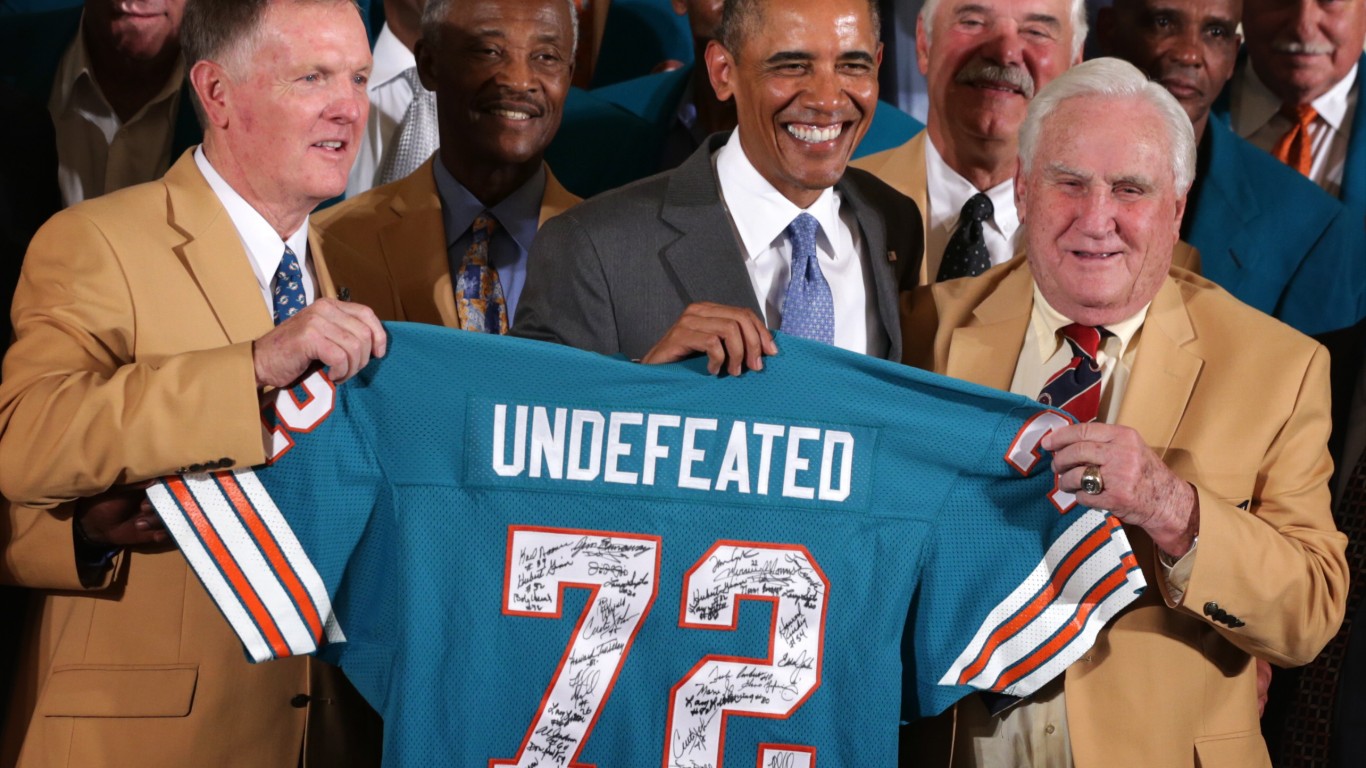 WASHINGTON, DC - AUGUST 20:  First row, U.S. President Barack Obama poses for photos with members of the 1972 Miami Dolphins including head coach Don Shula (R), quarterback Bob Griese (L), and running back Larry Csonka (4th L) during an East Room event August 20, 2013 at the White House in Washington, DC. President Obama hosted the undefeated 1972 Super Bowl champion who didnt get the chance to be honored at the White House back then.  (Photo by Alex Wong/Getty Images)