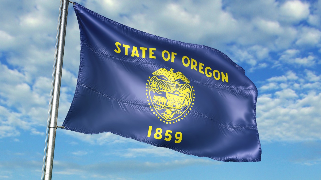 Oregon state of United States flag on flagpole waving cloudy sky background realistic 3d illustration