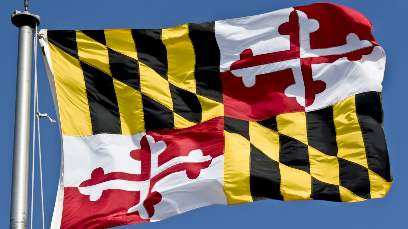 The colorful flag of the state of Maryland flying in a stiff breeze.