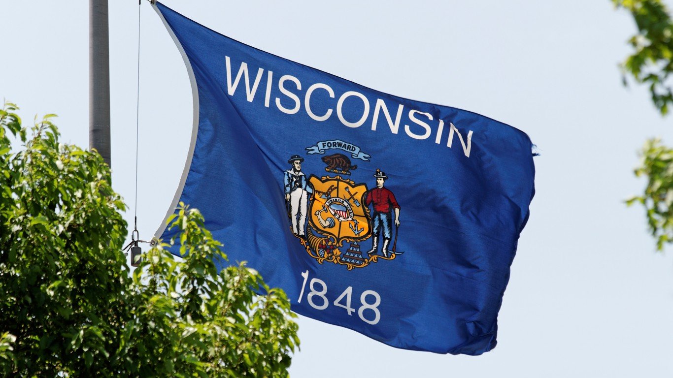 The Wisconsin state flag waving in the wind.