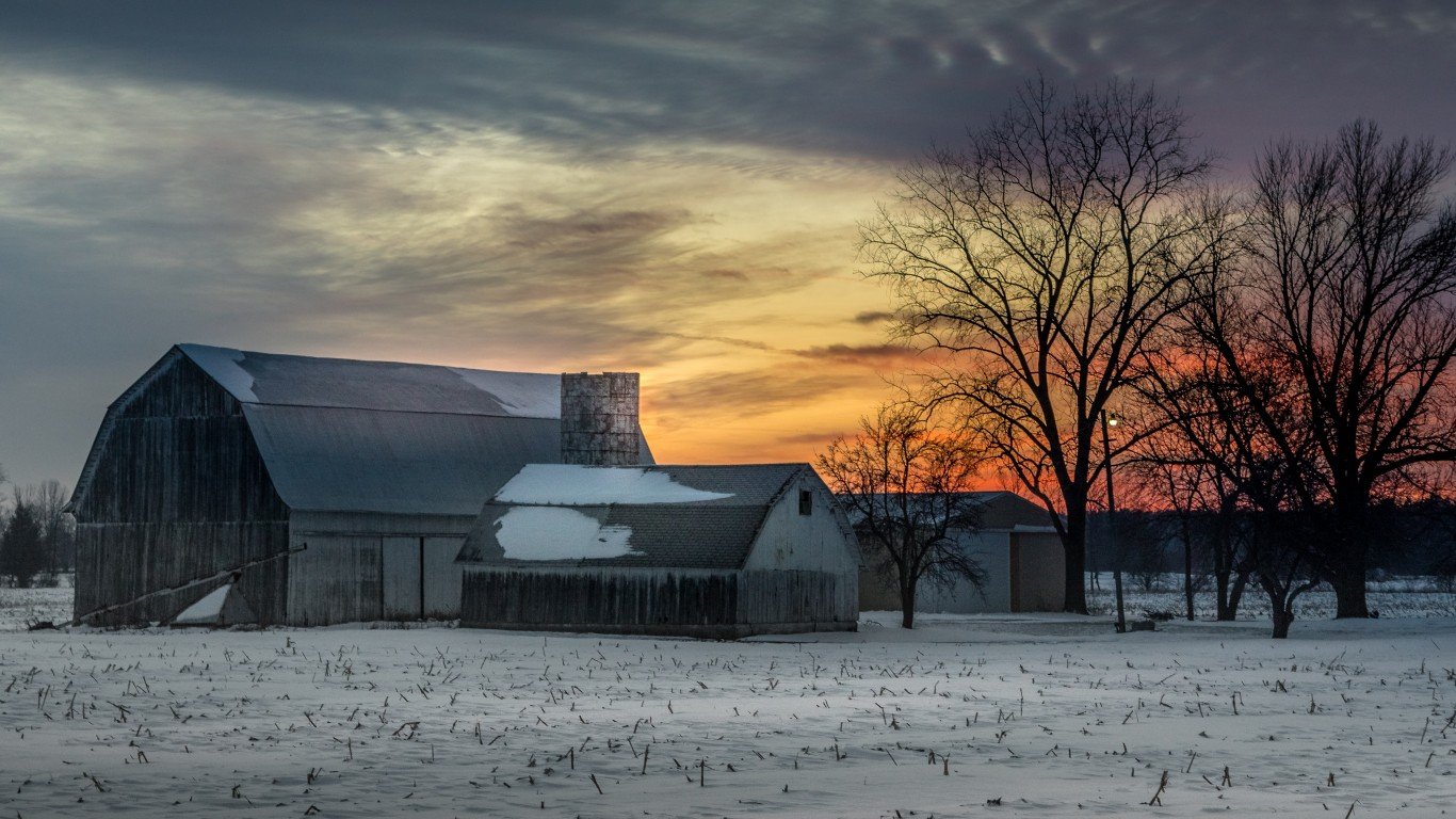 white barn - orange sky by Christian Collins