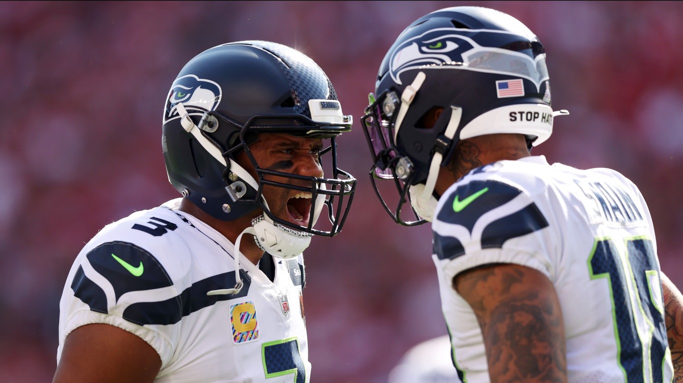 SANTA CLARA, CALIFORNIA - OCTOBER 03: Freddie Swain #18 (R) of the Seattle Seahawks celebrates his catch in the end-zone with teammate Russell Wilson #3 during the third quarter against the San Francisco 49ers at Levi's Stadium on October 03, 2021 in Santa Clara, California. (Photo by Ezra Shaw/Getty Images)