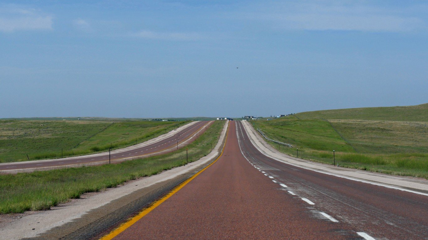 Straight paved red asphalt at Powder River Road in Gillette, Wyoming