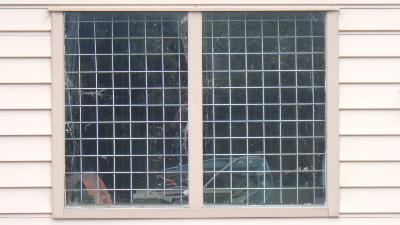 barred windows in weatherboard... by Mr Thinktank