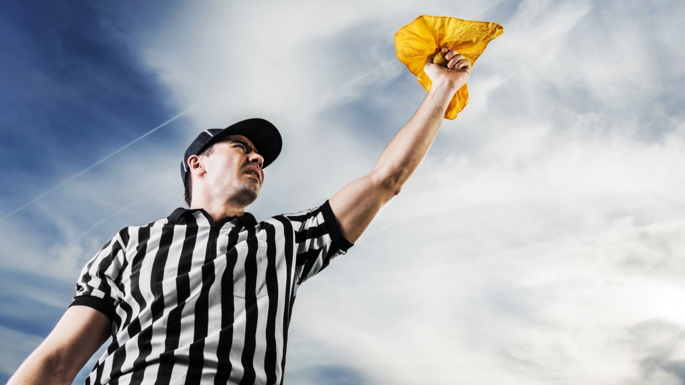 referee throwing a penalty flag