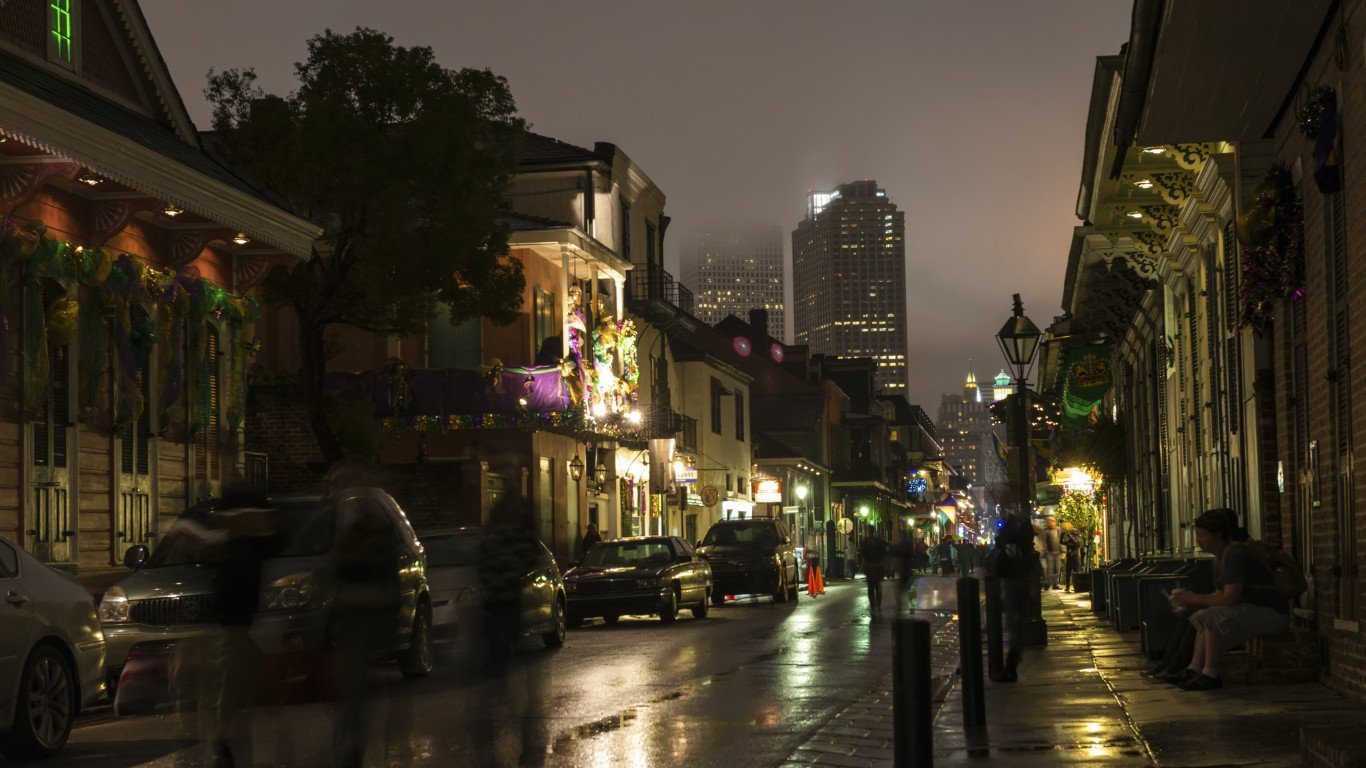 View down Bourbon Street toward downtown New Orleans, Louisiana. Taken after a rain and during Mardi Gras.