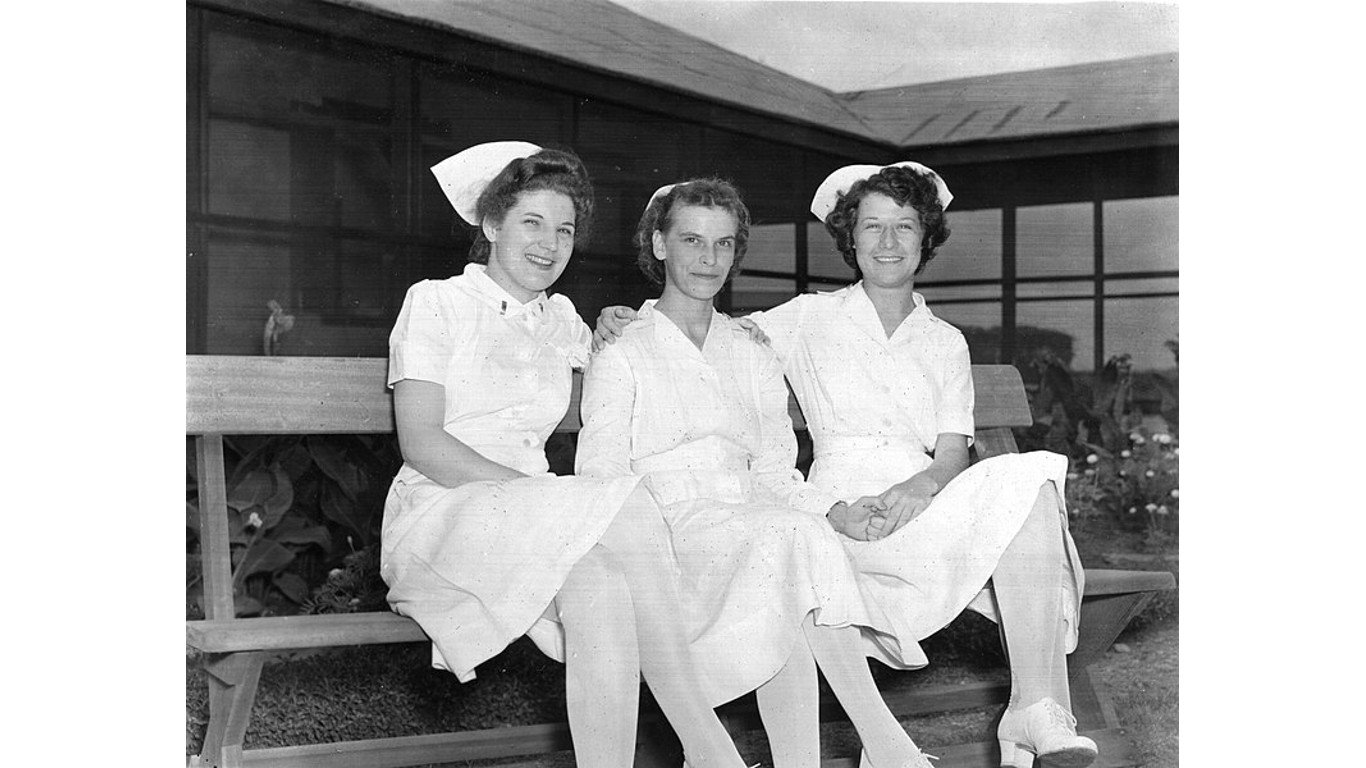 World War II nurses holding hands by Anasuyas