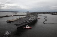 120309-N-DX364-015 EVERETT, Wash. (March 9, 2012) The Nimitz-class aircraft carrier USS Nimitz (CVN 68) arrives at its new homeport at Naval Station Everett after the completion of a docked planned incremental availability maintenance period at Bremerton, Wash. Nimitz is replacing USS Abraham Lincoln (CVN 72), which had been homeported at Naval Station Everett since January 1997. (U.S. Navy photo by Mass Communication Specialist 1st Class Joan E. Jennings/Released)