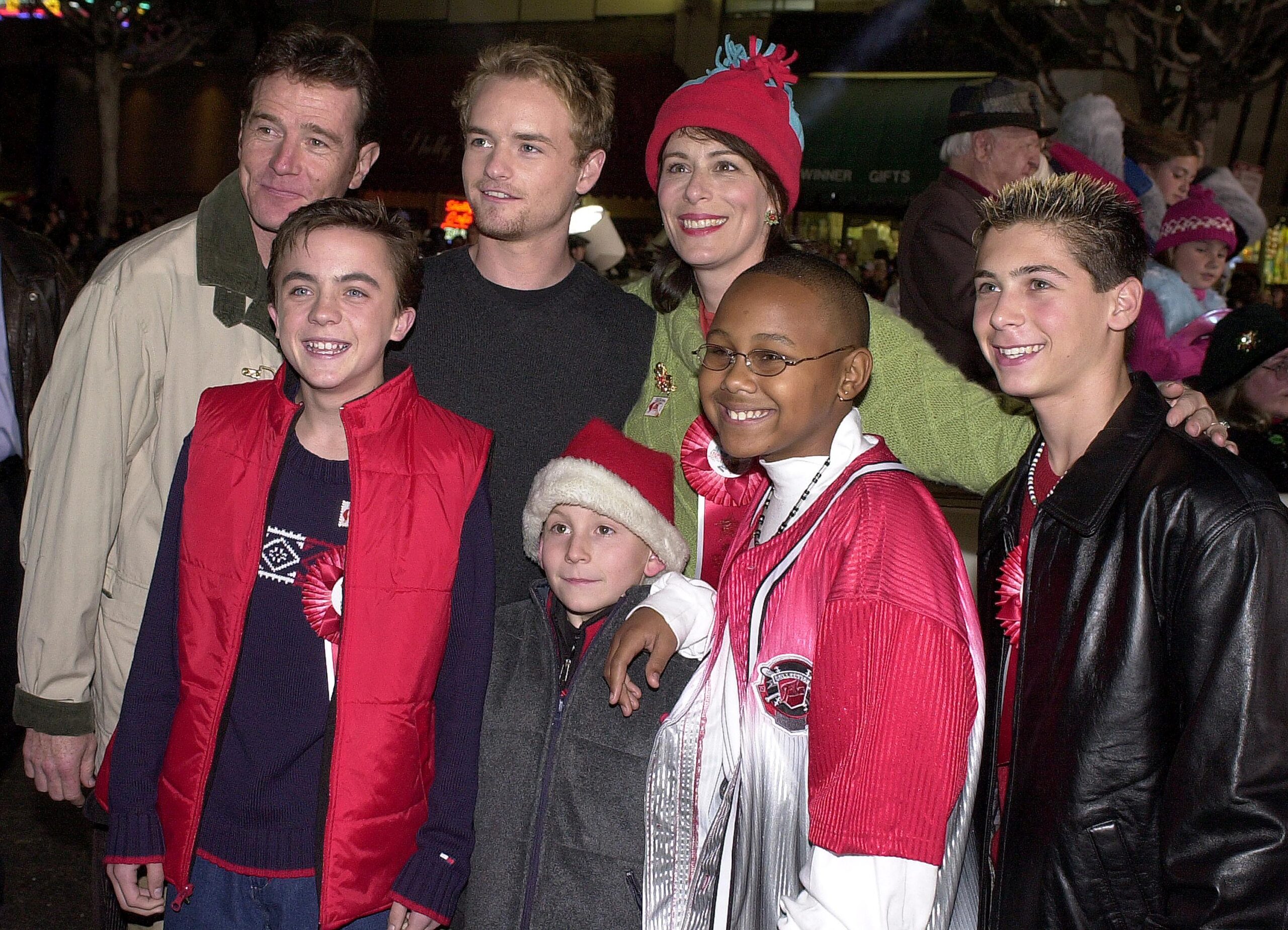 The cast of Malcolm in the Middle poses for a photo November 26, 2000 at the Hollywood Christmas Parade in Hollywood, CA. From left to right, the cast members are Bryan Cranston, Frankie Muniz, Christopher Masterson, Erik Per Sullivan, Jane Kaczmarek, in back, Craig Lamar Traylor, and Justin Berfield. (Photo by Newsmakers)