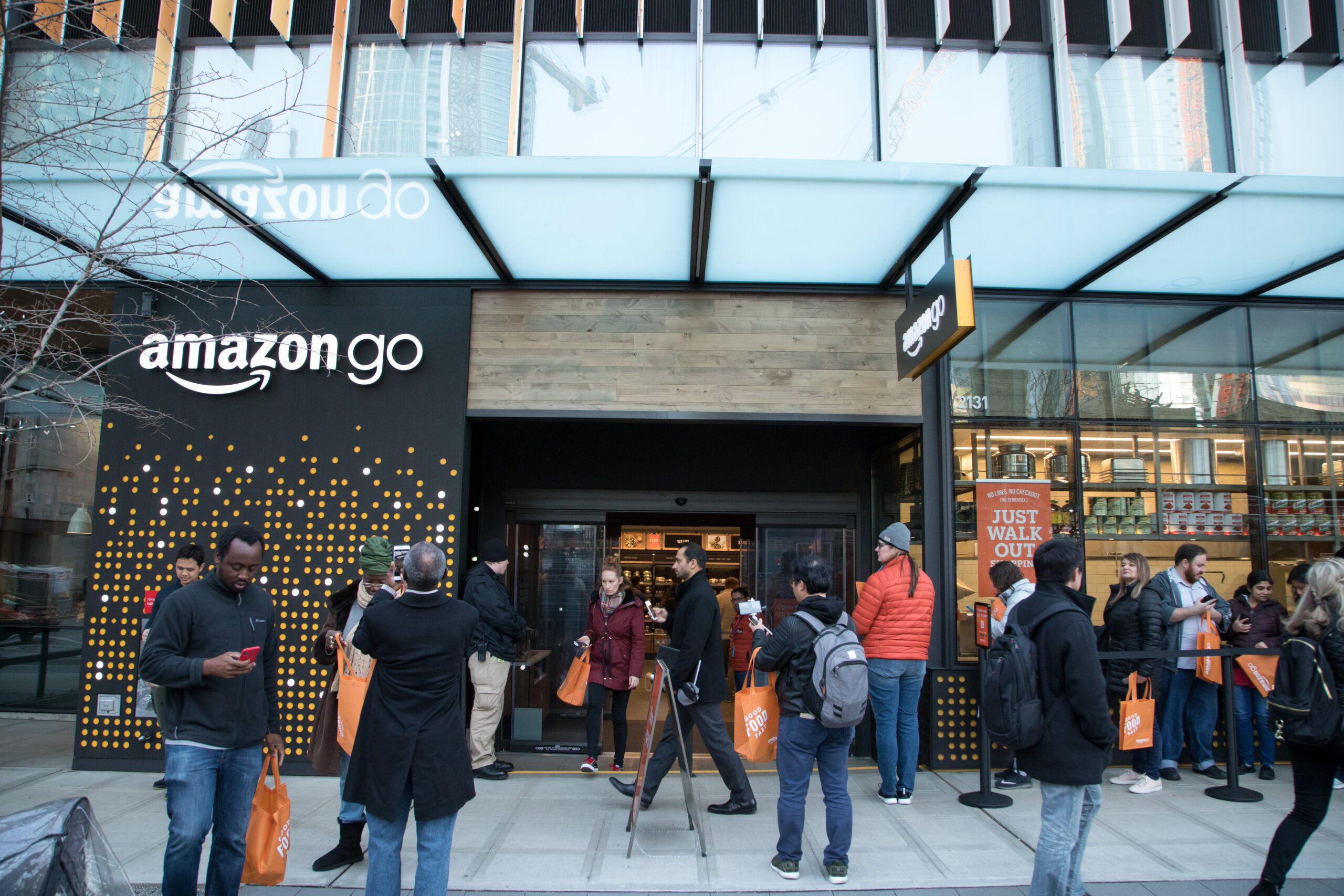 SEATTLE, WASHINGTON/USA - January 22, 2018: Wide angle view of customers waiting to enter the Amazon Go store, during the opening day at the Seattle Amazon headquarters