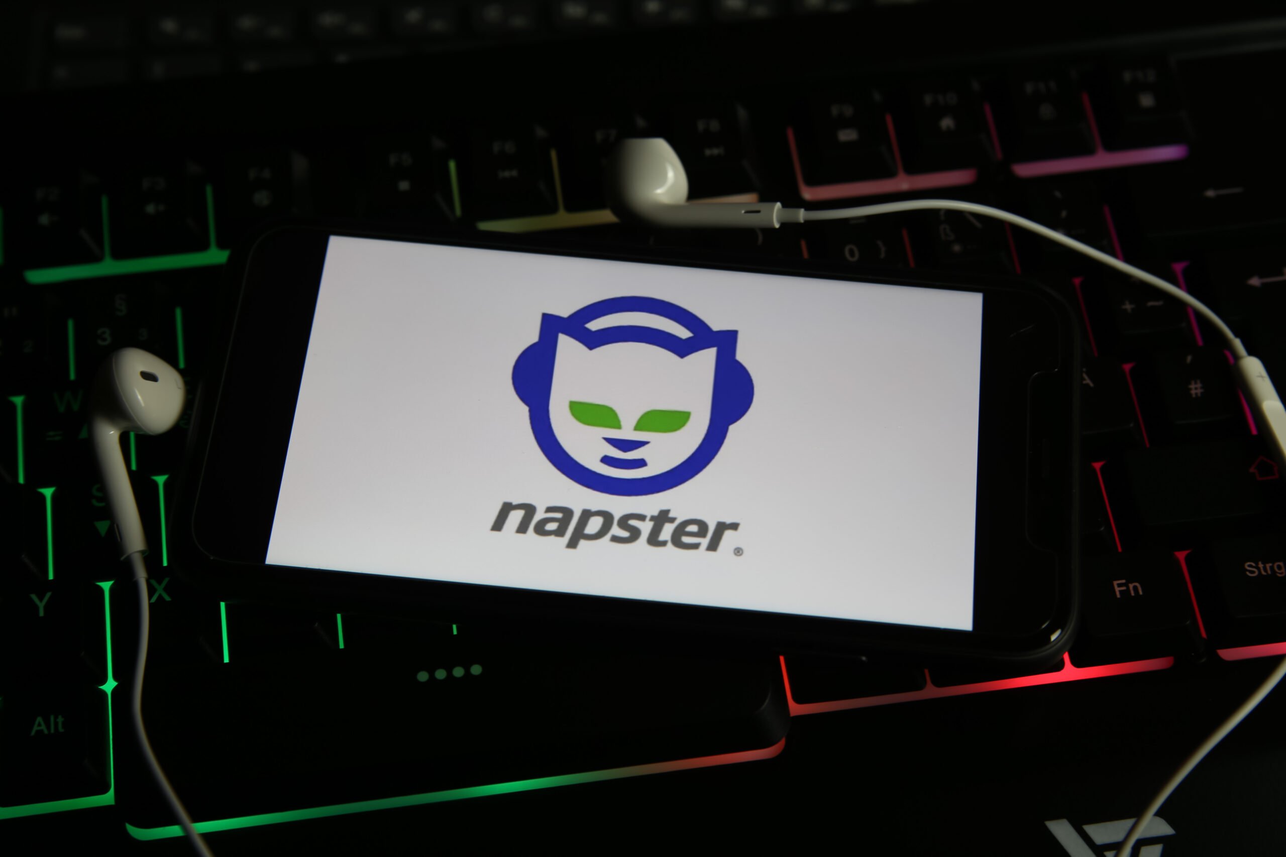 Napster logo with headphones on a keyboard