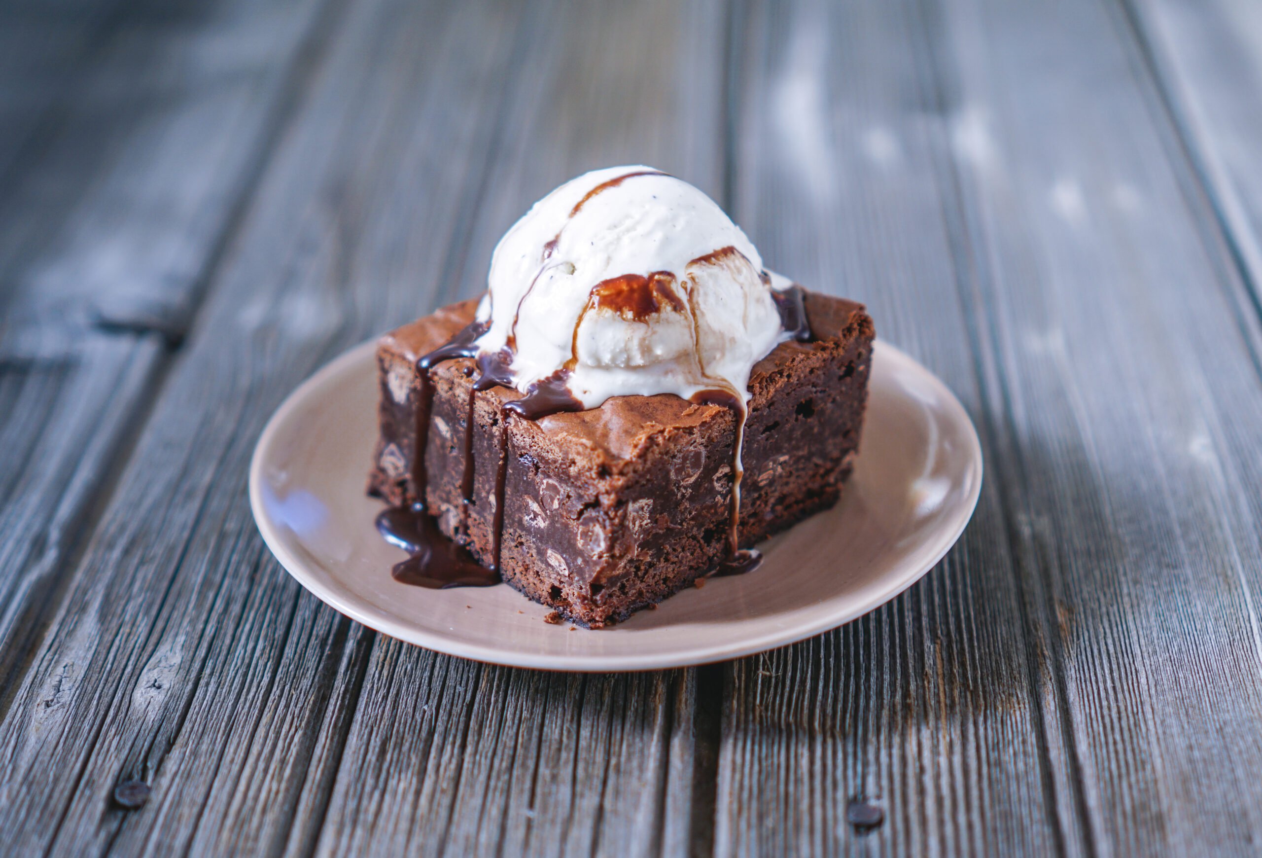 Chocolate Fudgy Brownie with Vanilla Ice Cream on top.