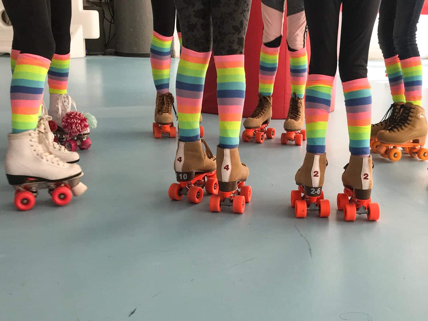 Girls roller skate party with colorful socks