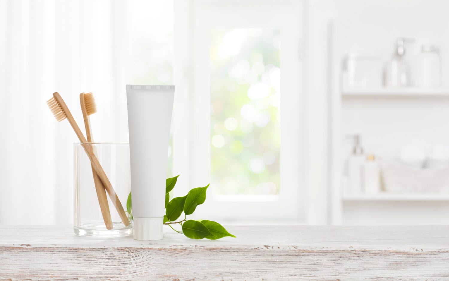 Eco bamboo toothbrushes and toothpaste tube mockup with copy space