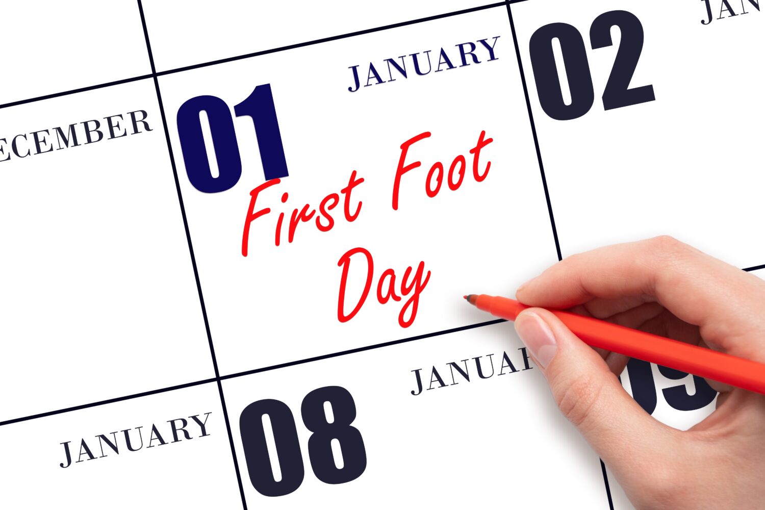 January 1. Hand writing text First Foot Day on calendar date. Save the date. Holiday. Day of the year concept.
