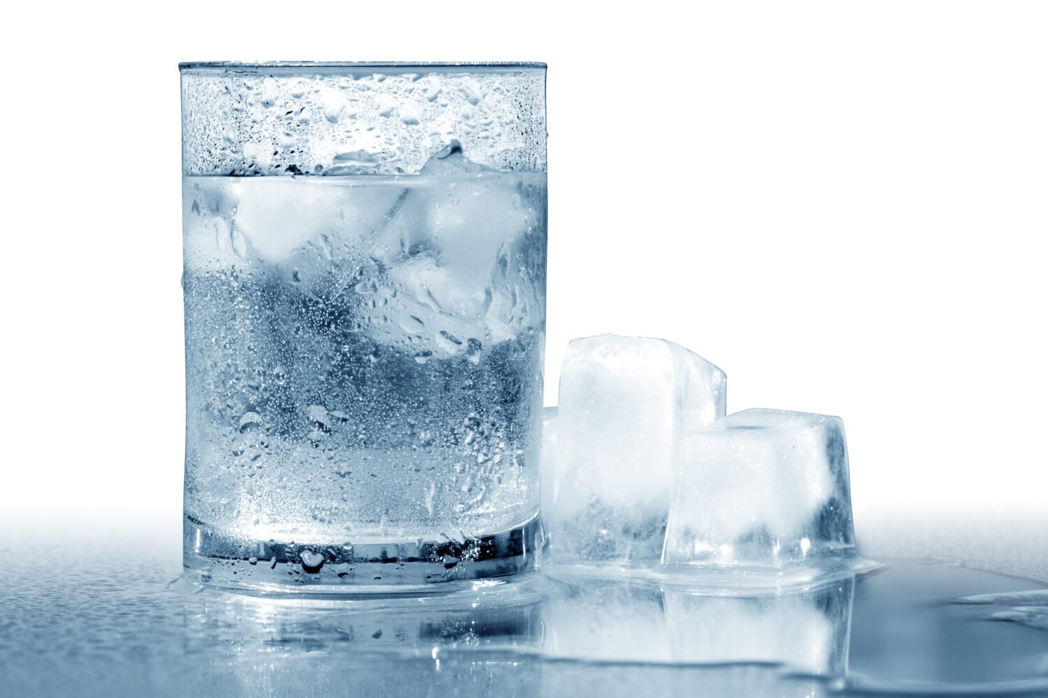 Glass of very cold water with ice cubes. Isolated with clipping path