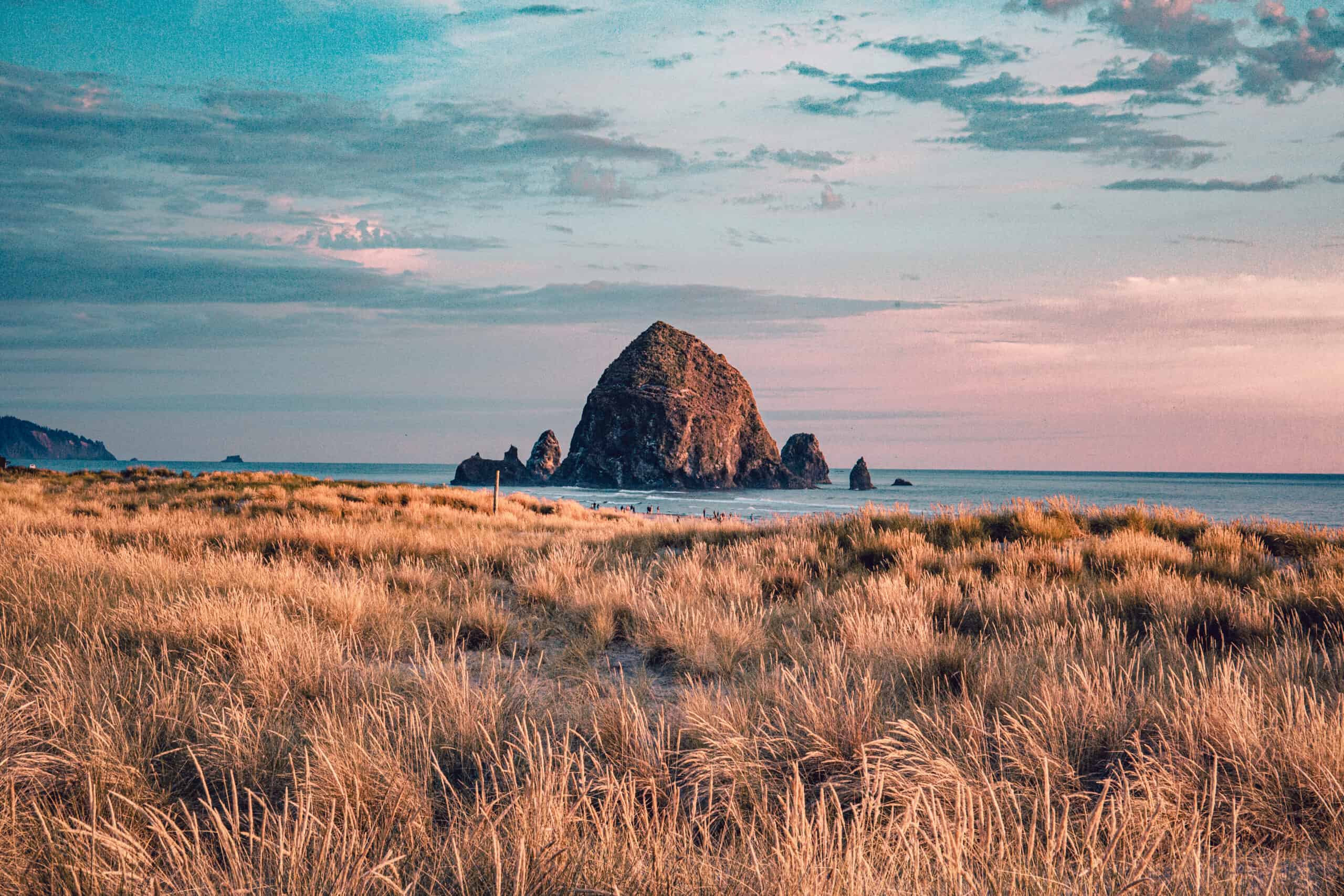 Cannon Beach, Oregon coast: the famous Haystack Rock in the golden light before sunset
