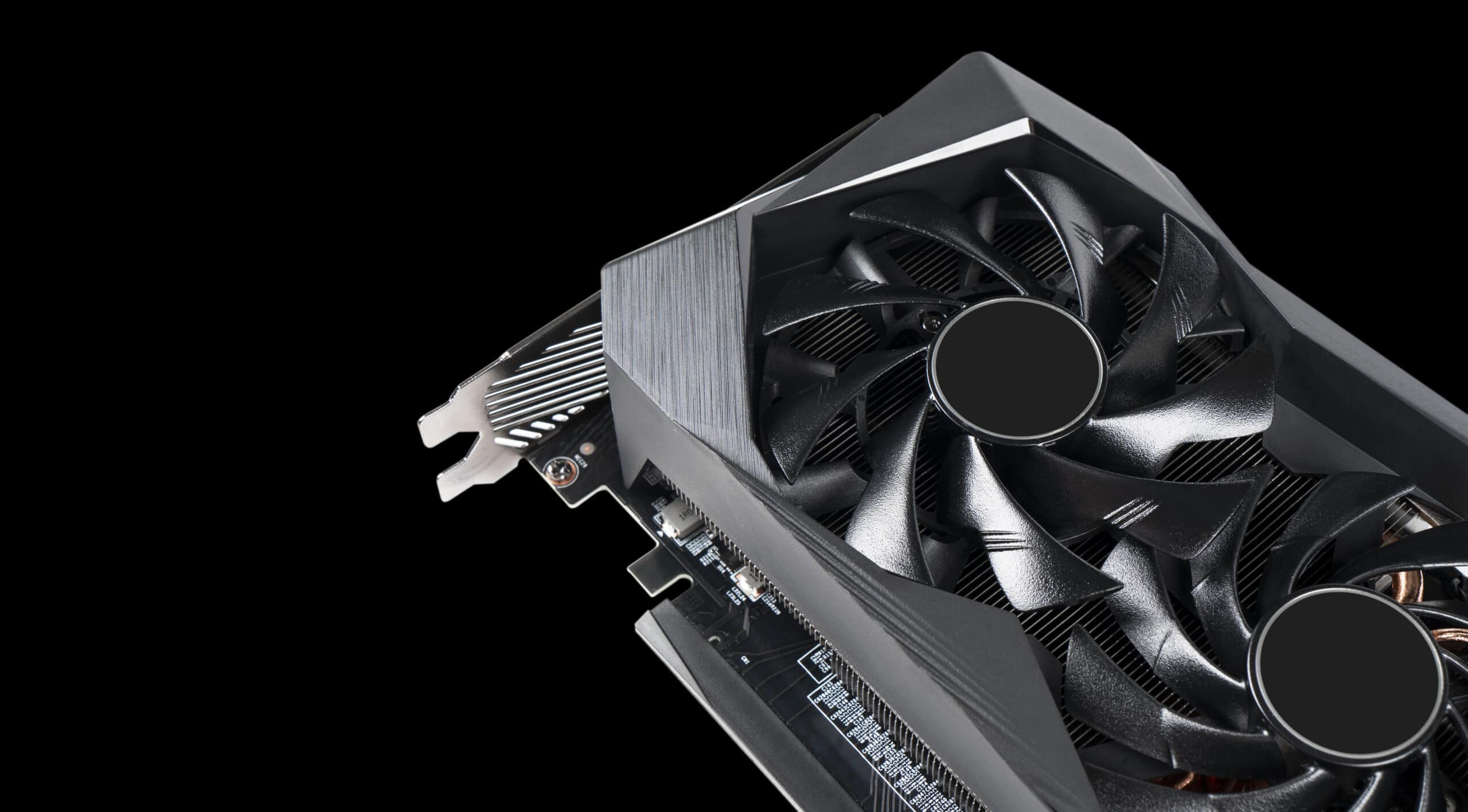 Video card with fan. Gaming graphics card for video games and cryptocurrency mining. Game video card isolated on black background. Electronic device, computer part. GPU card
