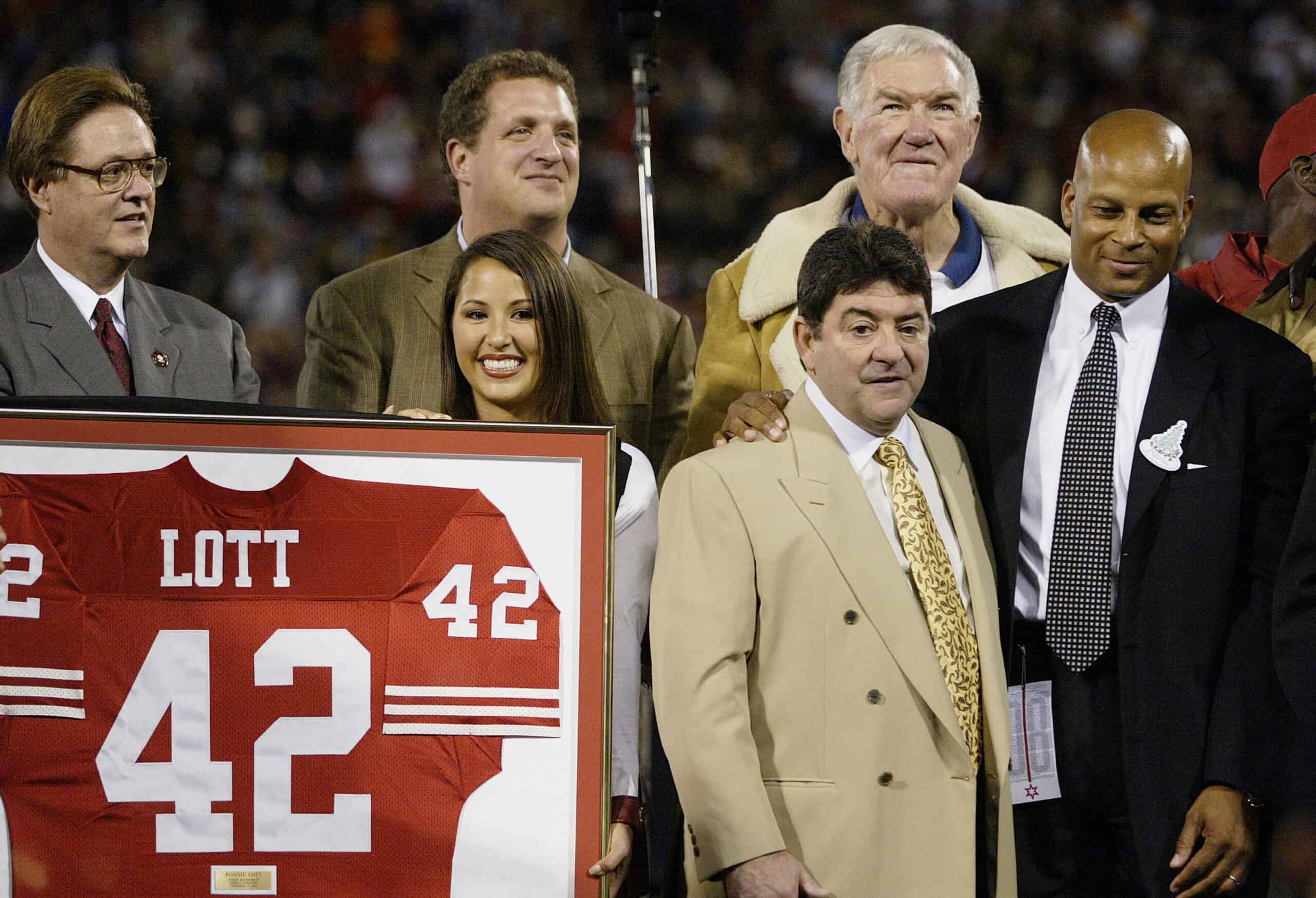 SAN FRANCISCO - NOVEMBER 17: Former San Francisco 49er Ronnie Lott (R) has his #42 jersey retired during a ceremony with former owner Ed DeBartotlo Jr. , former teammates and family at halftime during the Pittsburgh Steelers v San Francisco 49ers game on November 17, 2003 at Candlestick Park in San Francisco, California. (Photo by Jonathan Ferrey/Getty Images)