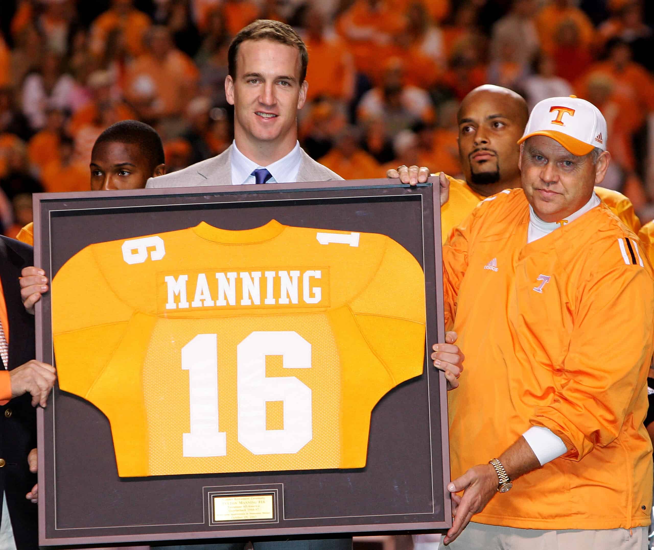 KNOXVILLE, TN - OCTOBER 29: Former Tennesse quarterback Peyton Manning and current quarterback for the Indianapolis Colts is honored alongside his former college coach Phillip Fulmer before the start of the game against the South Carolina Gamecocks on October 29, 2005 at Neyland Stadium in Knoxville, Tennessee. (Photo by Streeter Lecka/Getty Images)