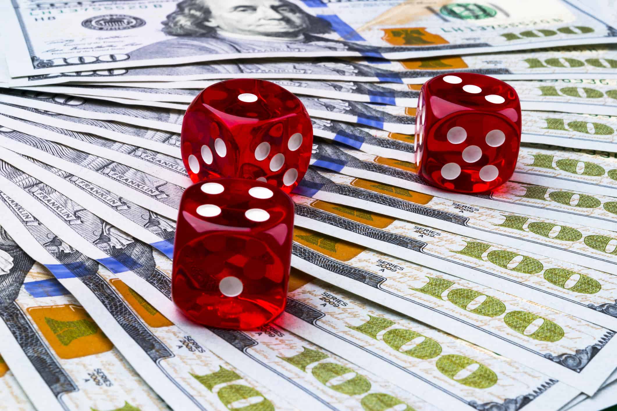 Poker dice rolls on a dollar bills, Money. Poker table at the casino. Poker game concept. Playing a game with dice. Casino dice rolls. Concept for business risk. chance good luck