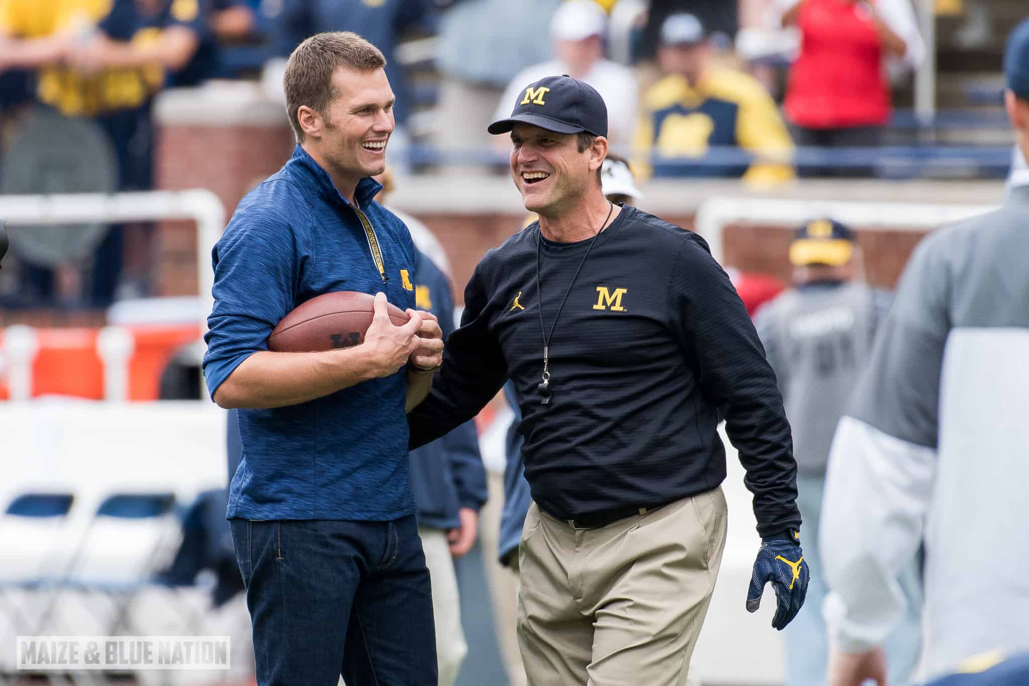 Tom Brady plays catch with Head Coach Jim Harbaugh before Michigan's 45-28 victory over Colorado on September 17, 2016. (James Coller/Maize and Blue Nation)