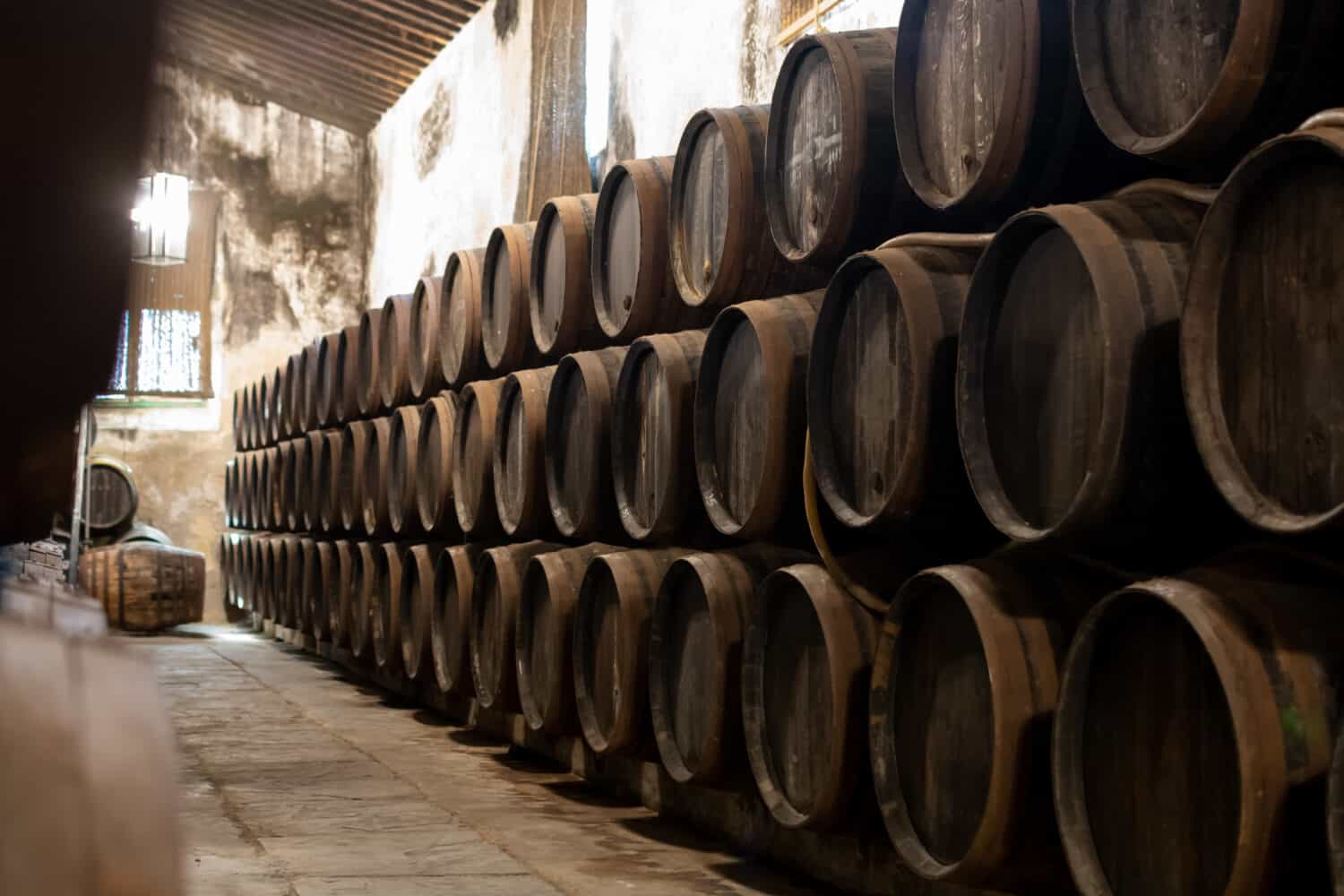 Production of fortified jerez, xeres, sherry wines in old dark oak barrels in sherry triangle, Jerez la Frontera, El Puerto Santa Maria and Sanlucar Barrameda Andalusia, Spain