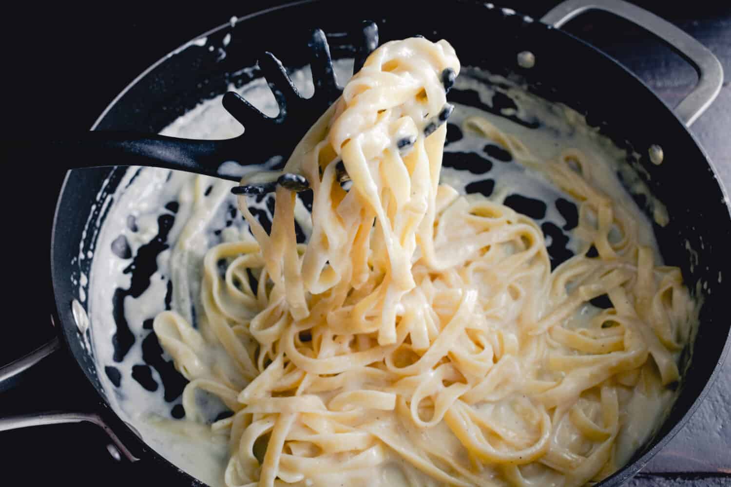Fettuccine Alfredo in a Saute Pan: Freshly made noodles in a creamy parmesan cheese sauce