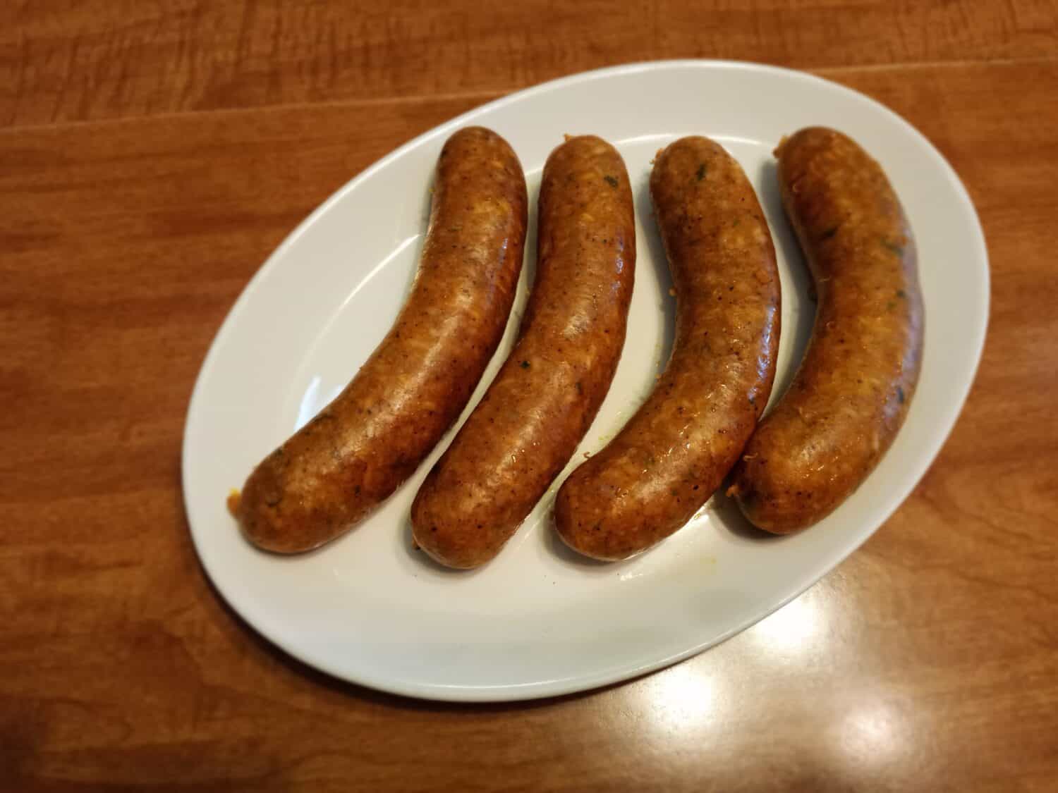 Four Boudin Links Stuffed With Ground Pork, Rice, Onions, and Seasoning in Natural Pork Casing. Louisiana Cajun Cuisine