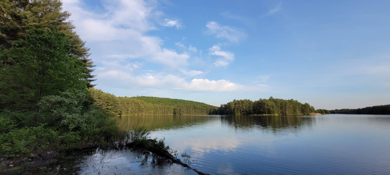 Sky, hills and trees reflected in the Quabbin Reservoir, Massachusetts