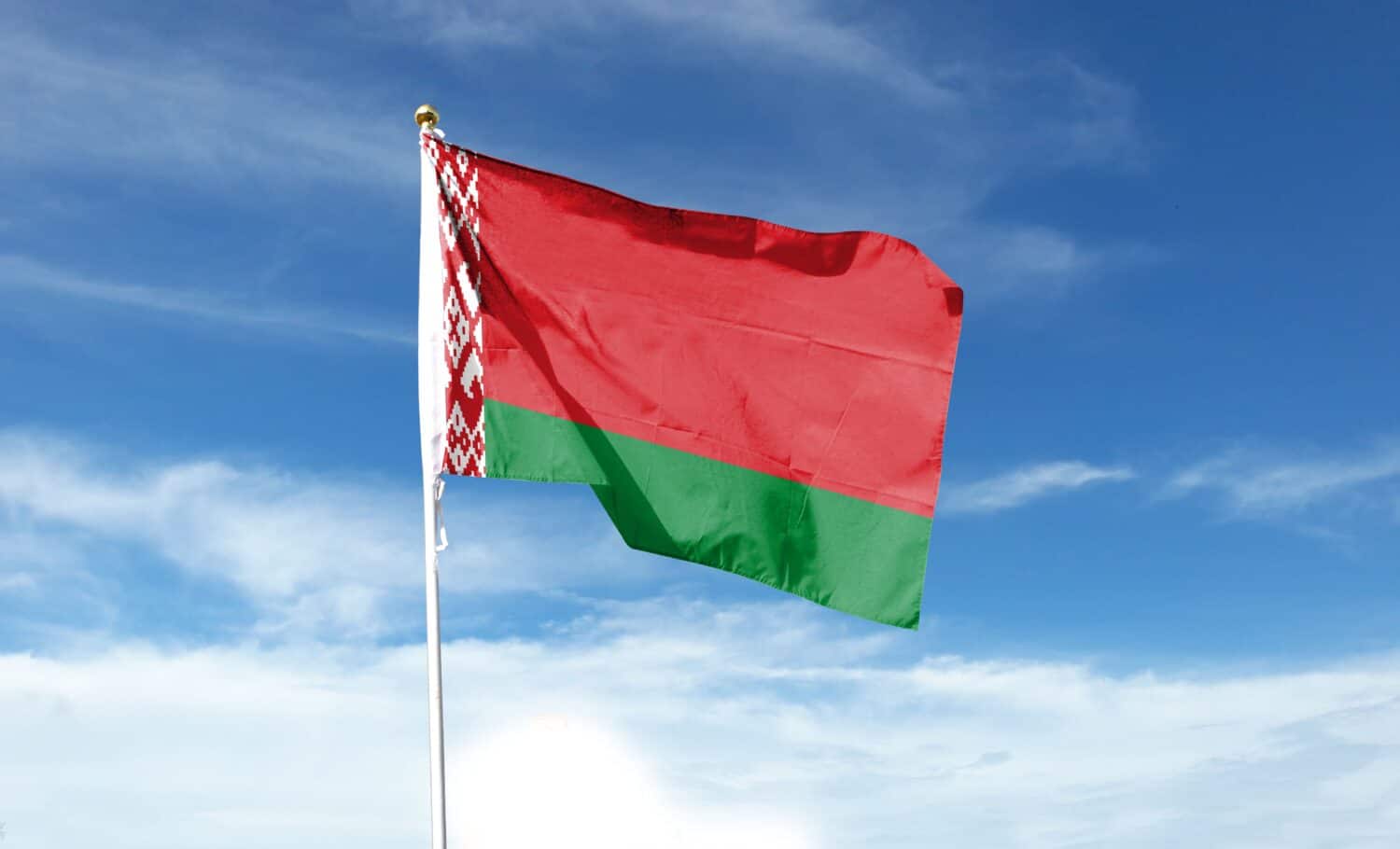 Belarus flag on cloudy sky. waving in the sky