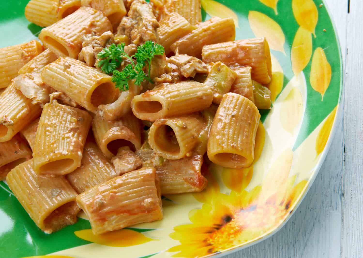 Chicken riggies - Italian-American pasta dish.area of New York State.consisting of chicken, rigatoni and hot or sweet peppers in a spicy cream and tomato sauce.
