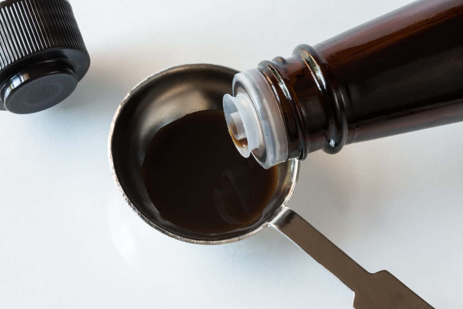 Pouring Worcestershire Sauce in a Teaspoon