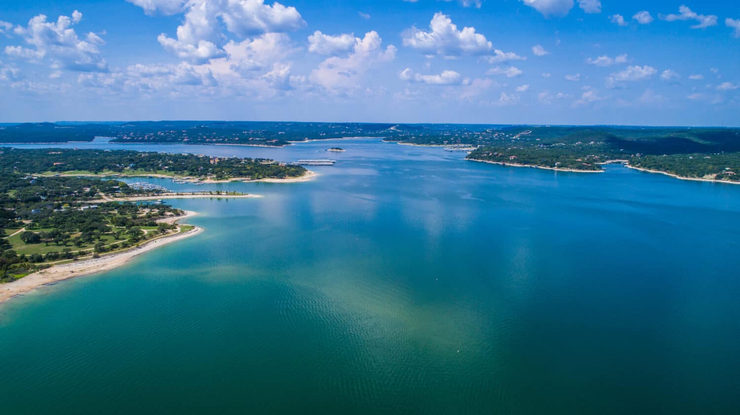 Reflections on the water Lake Travis a paradise of clear blue water and relaxation right outside Austin Texas an amazing summer landscape on the lake aerial drone view high above lake