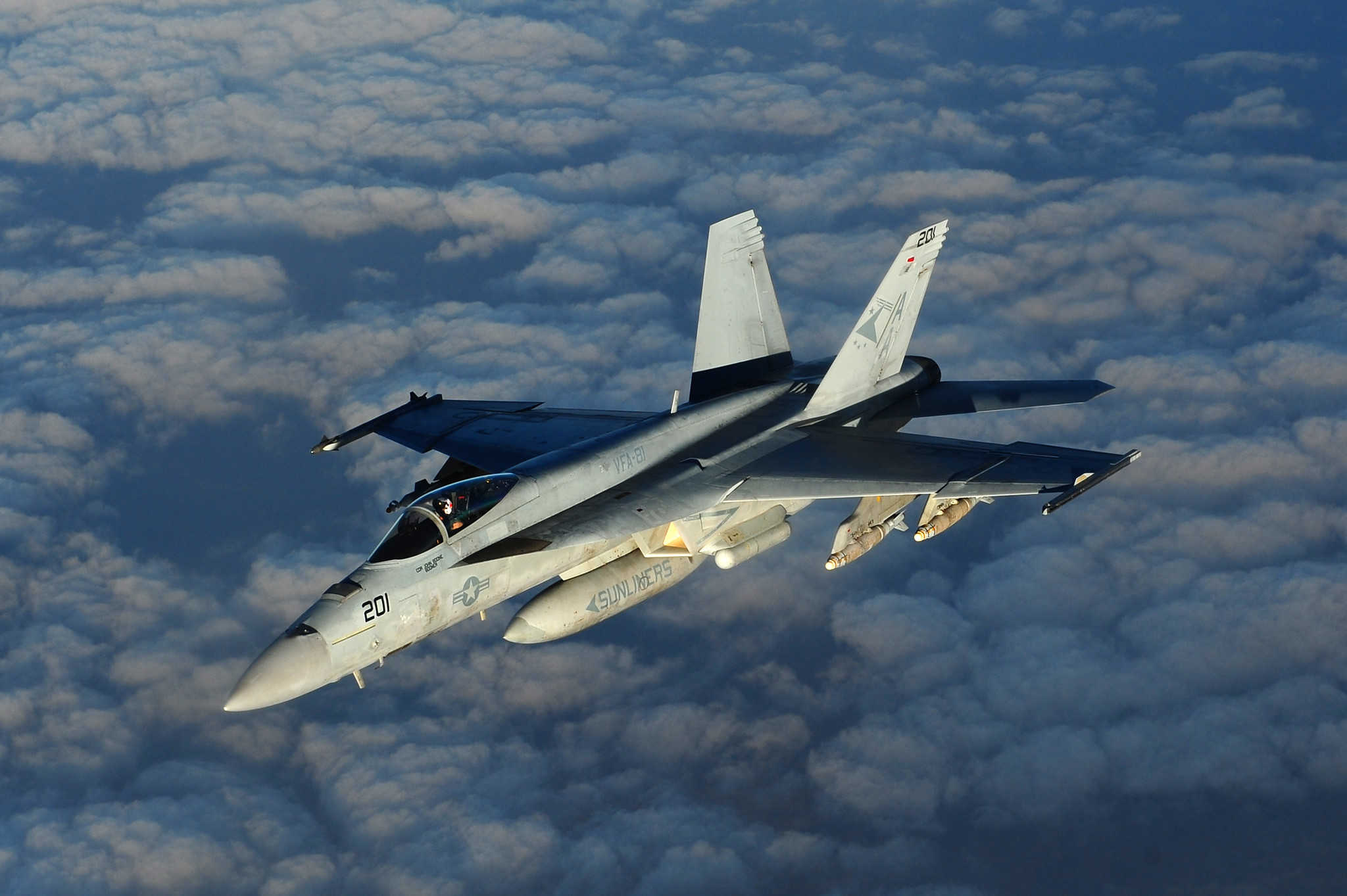 A Navy Boeing F/A-18 "Super Hornet", assigned to the USS Carl Vinson, returns to its mission after being refueled by an Air Force Boeing KC-135 "Stratotanker" assigned to the 340th Expeditionary Air Refueling Squadron in the skies above Afghanistan in support of Operation Enduring Freedom, Mar. 2, 2011.