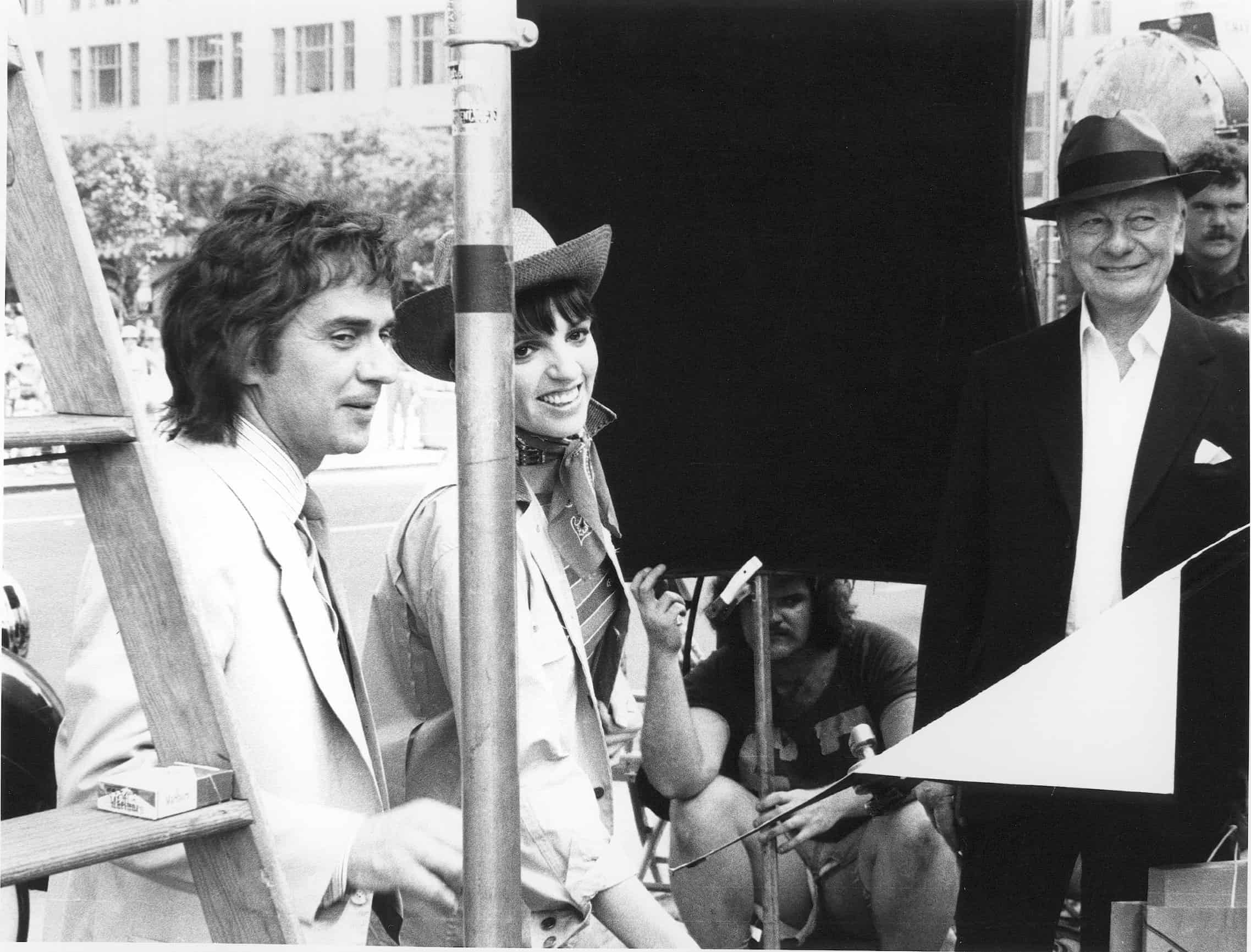 Dudley Moore, Liza Minnelli and Sir John Gielgud on the set of "Arthur" filming in New York City 1979