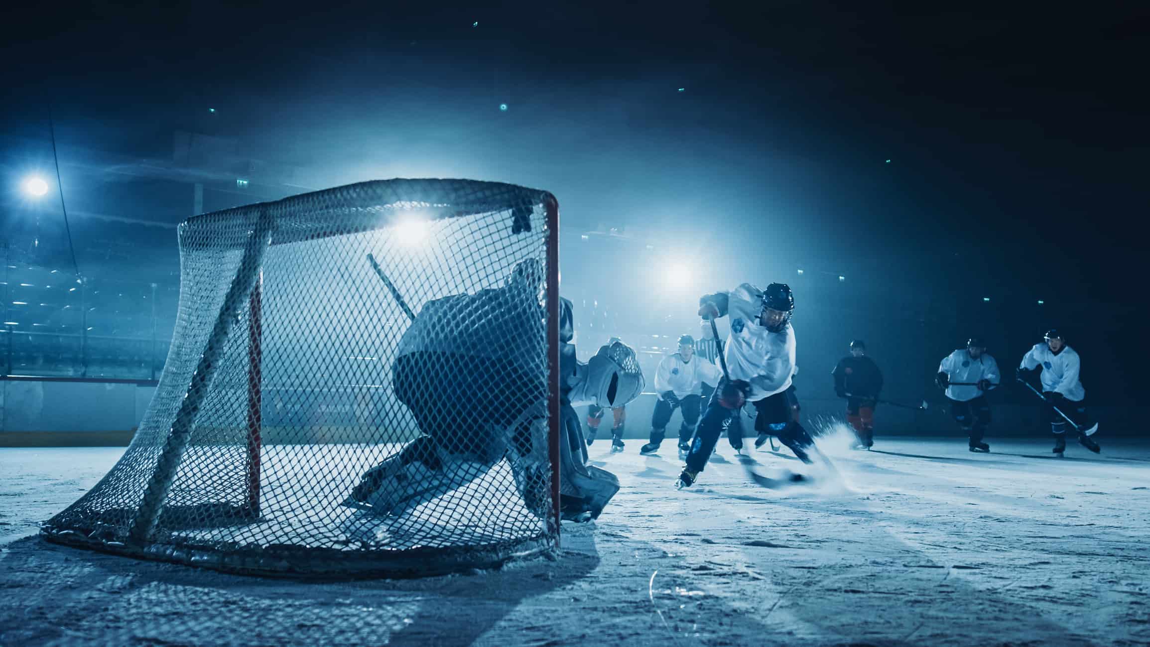Ice Hockey Rink Arena: Goalie against Forward Player who Does Slapshot, Shots Puck with Stick and Scores Goal. Forwarder against Goaltender.