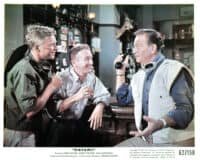 Hardy Krüger, Red Buttons and John Wayne at a bar in a scene from the film 'Hatari!', 1962. (Photo by Paramount/Getty Images)