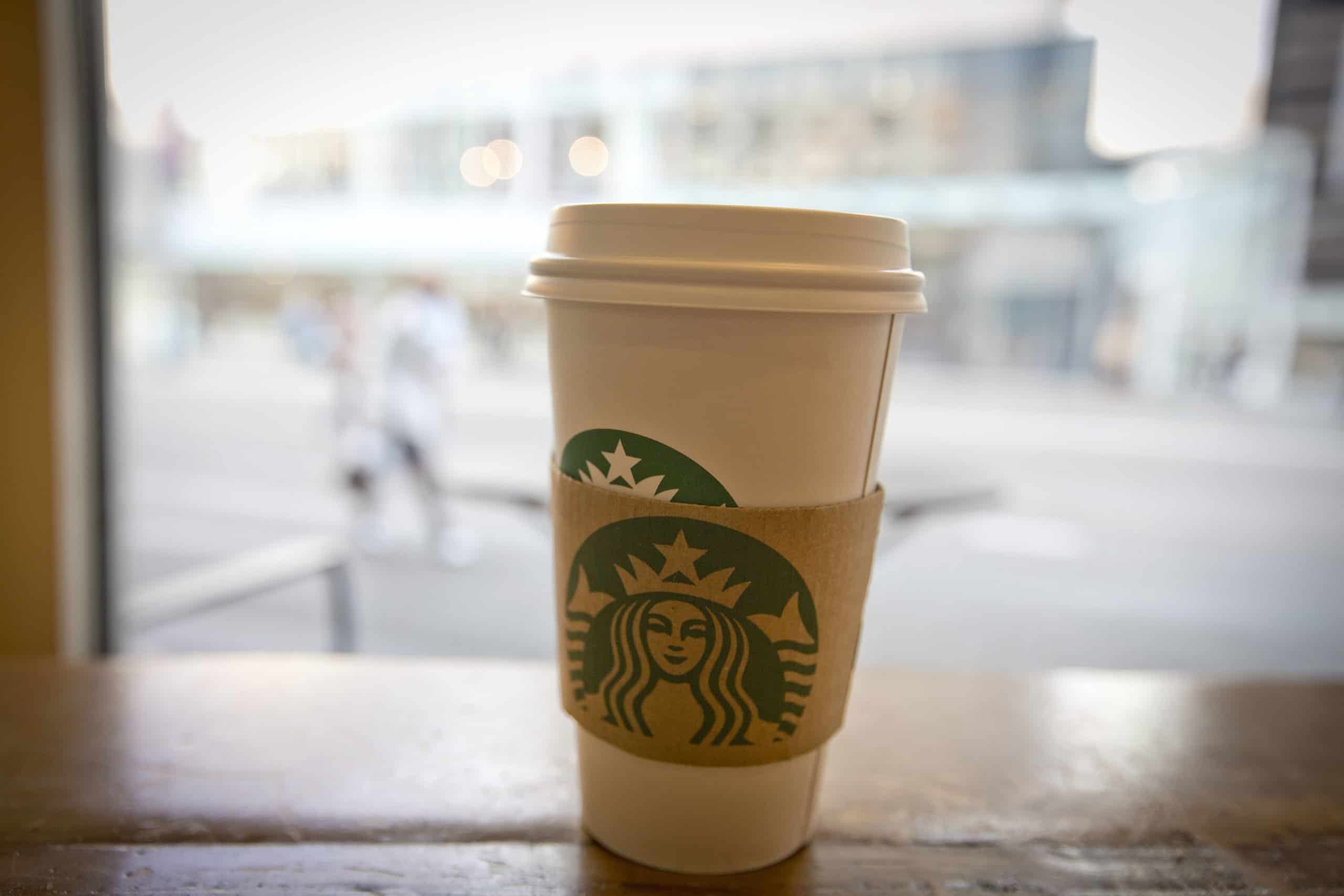 Starbucks coffee cup with sleeve