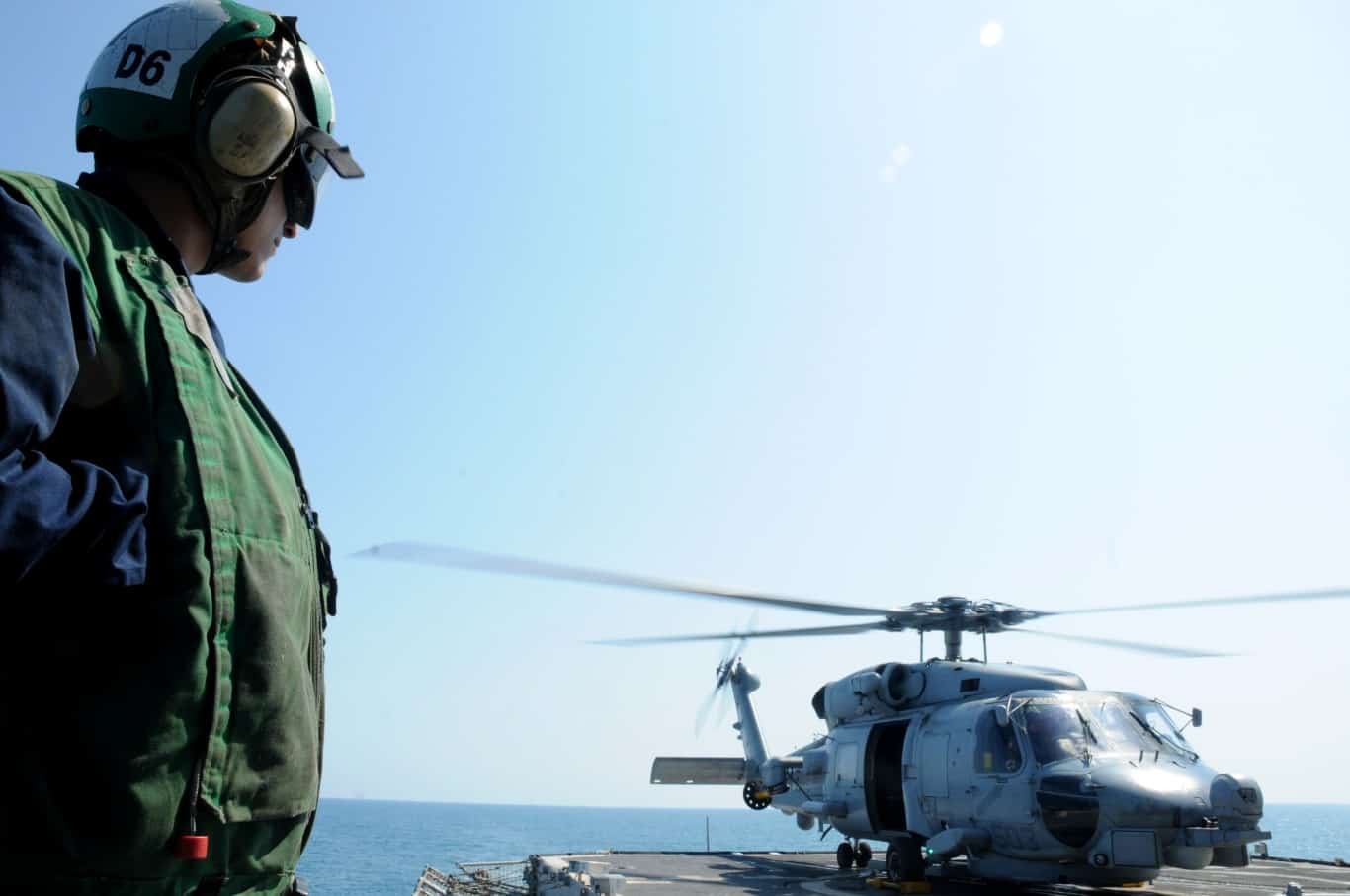 Denmark+Black+Hawk+helicopter | Sailor observes as an SH-60 Sea Hawk helicopter prepares for take off from the guided-missile cruiser USS Monterey